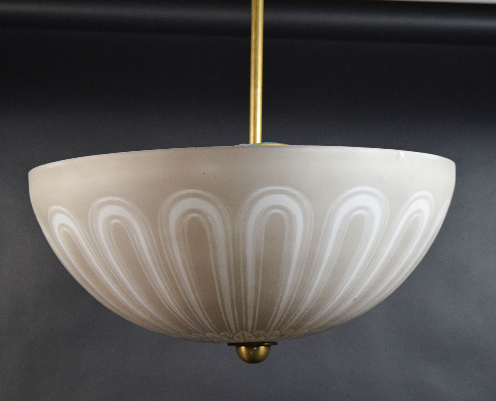 Art Deco Brass & Glass Pendant Light: Art deco brass and glass pendant hanging light fixture. Brass light, with frosted glass dome. Unsigned. 29" from top of cap to bottom of finial, shade 17 1/2"-diameter. Shade with roughness and fleabi