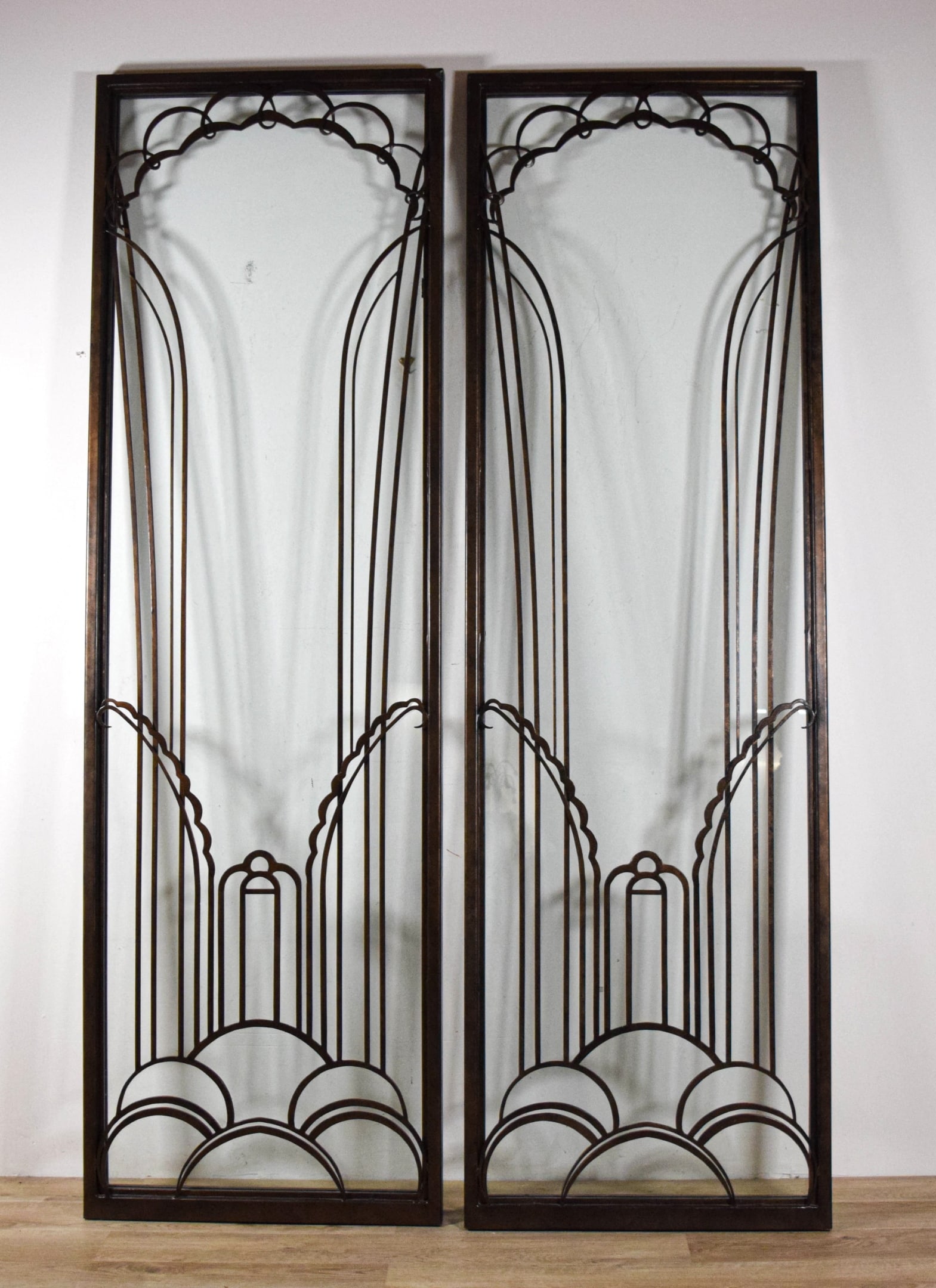 Pair of Art Deco Style Glass & Metal Door Panels: Pair of art deco style glass and patinated metal door panels. Unsigned. Each 99 1/4" x 30 3/4".