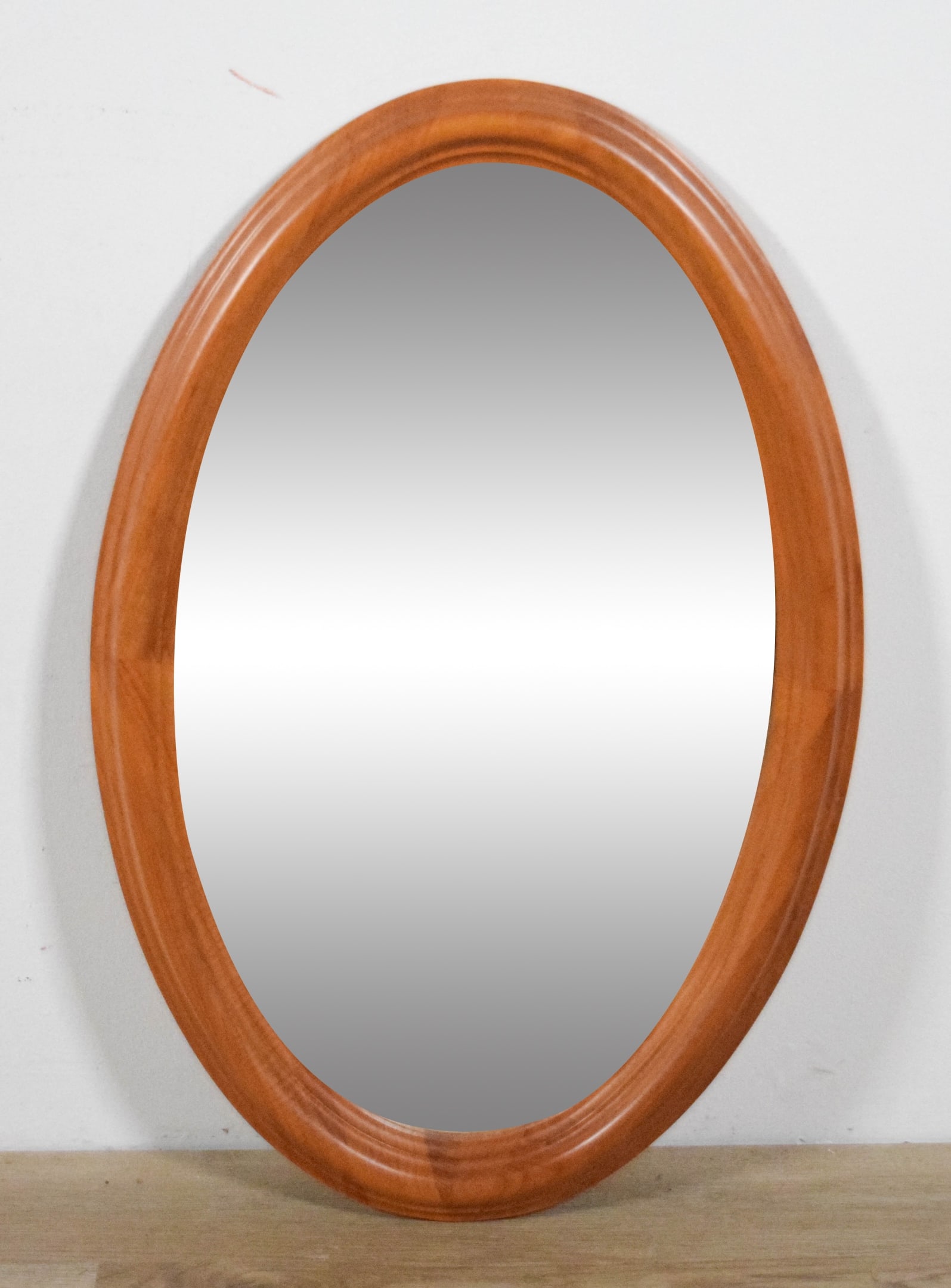 JS Danish Modern Oval Mirror: Danish modern oval mirror. JS Made in Denmark paper label on the reverse. 30 1/2" x 20 1/8".