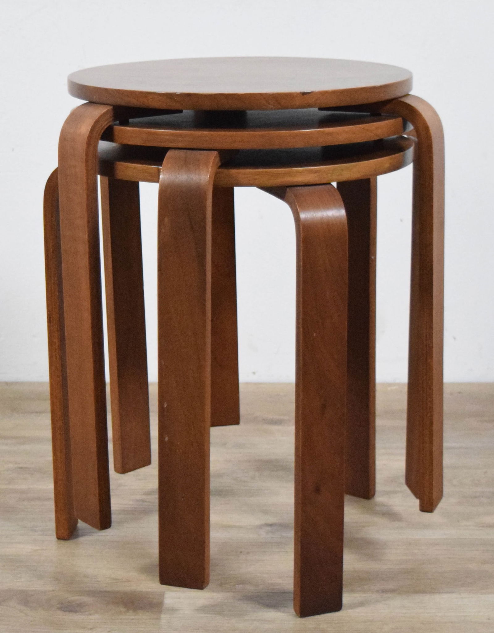 Danish Modern Nest of 3 Tables: Danish modern nest / stack of 3 tables. Unsigned. Each 17 5/8"H x 14"-diameter at tops. All with minor scratches and wear.
