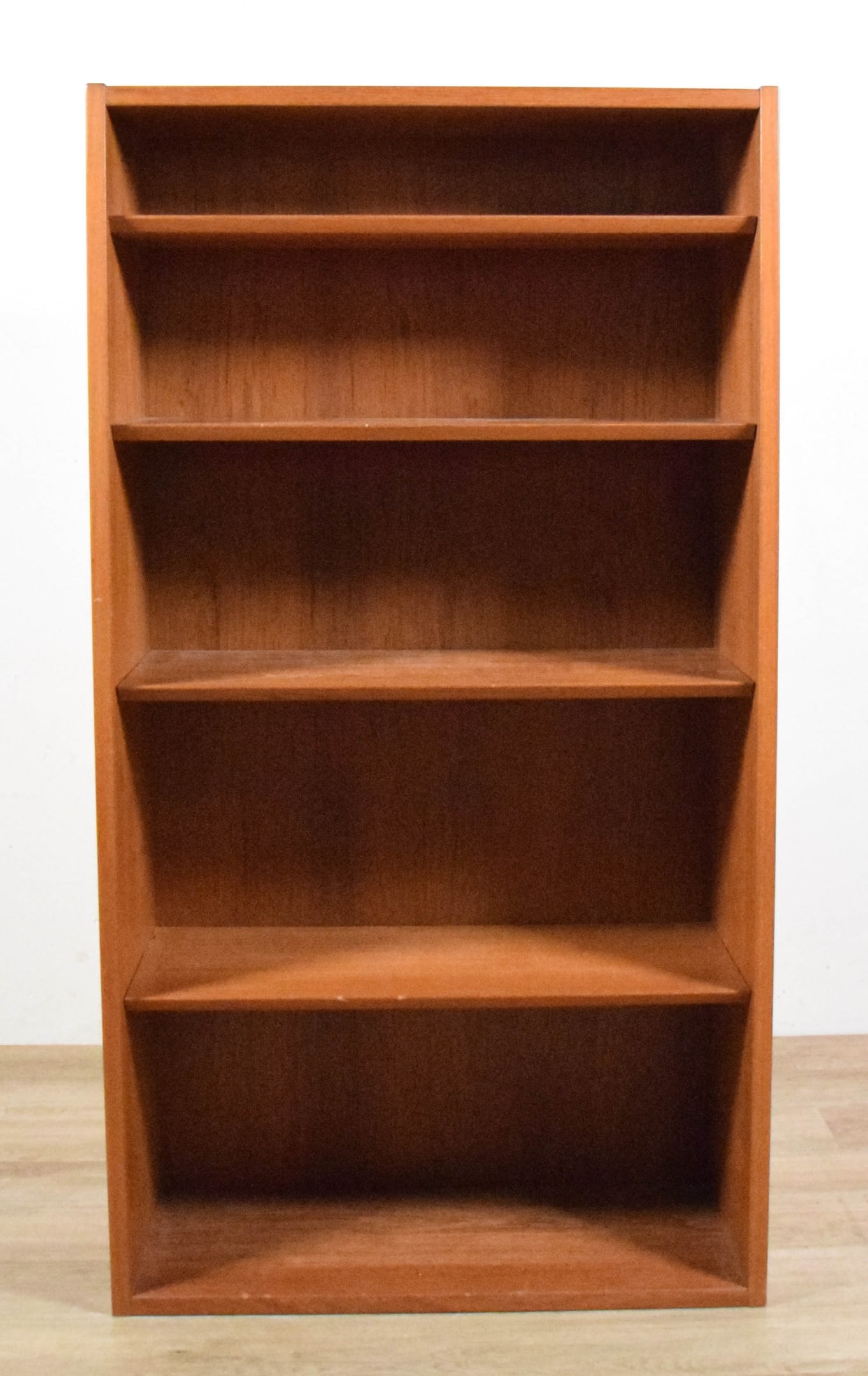 Danish Modern Style Bookcase: Danish mid-century modern style bookcase. Unsigned. 50 3/4"H x 27 5/8"W x 12"D. Chips to fronts of shelves.