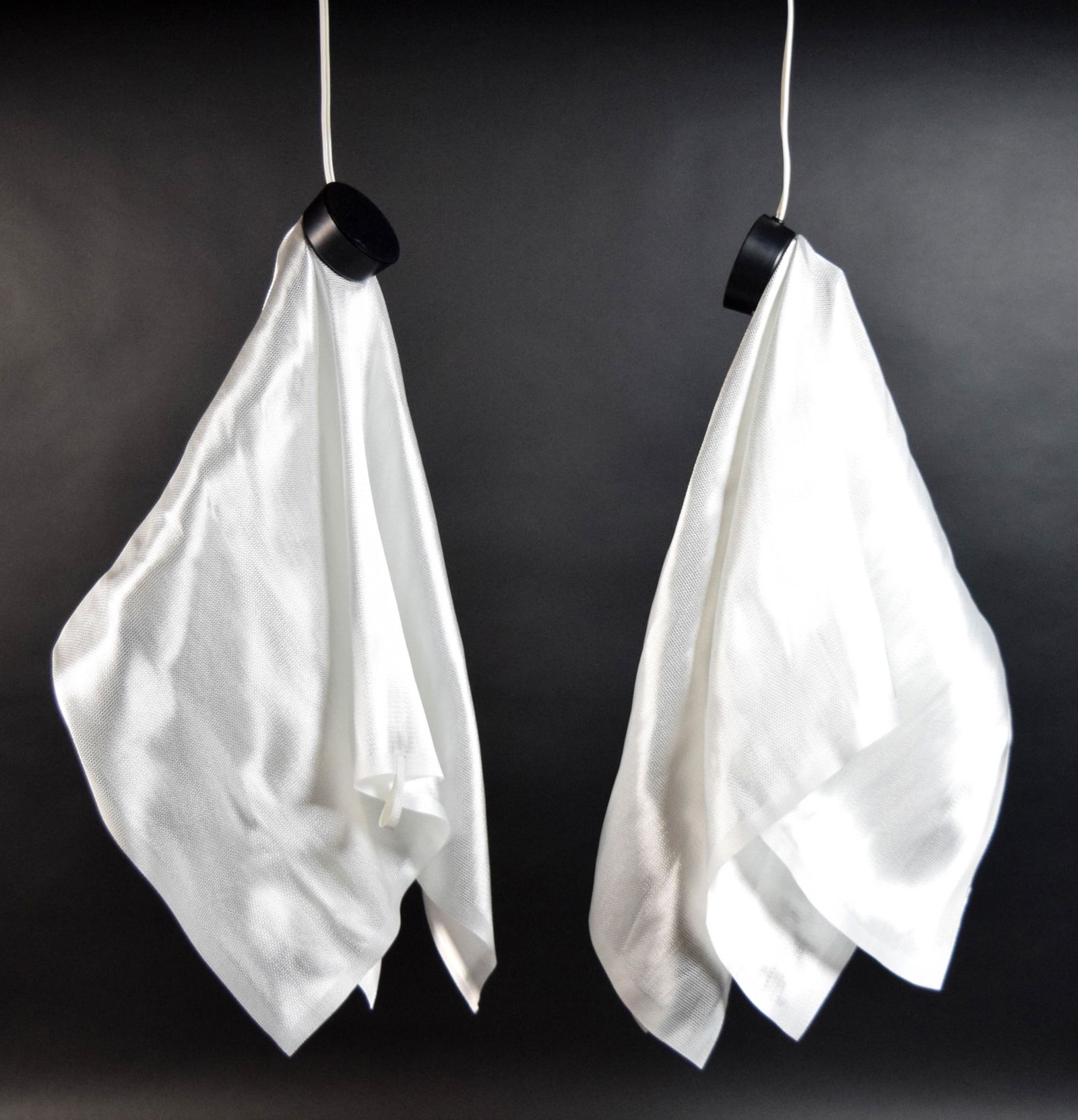 Pair of van Nieuwenborg & Wegman Delight Lamps: Pair of Frans van Nieuwenborg and Martijn Wegman Delight lamps. Heat resistant glass fiber cloth with socket. With original boxes and papers. Each 24"L. Boxes both with some wear, minor staining and d