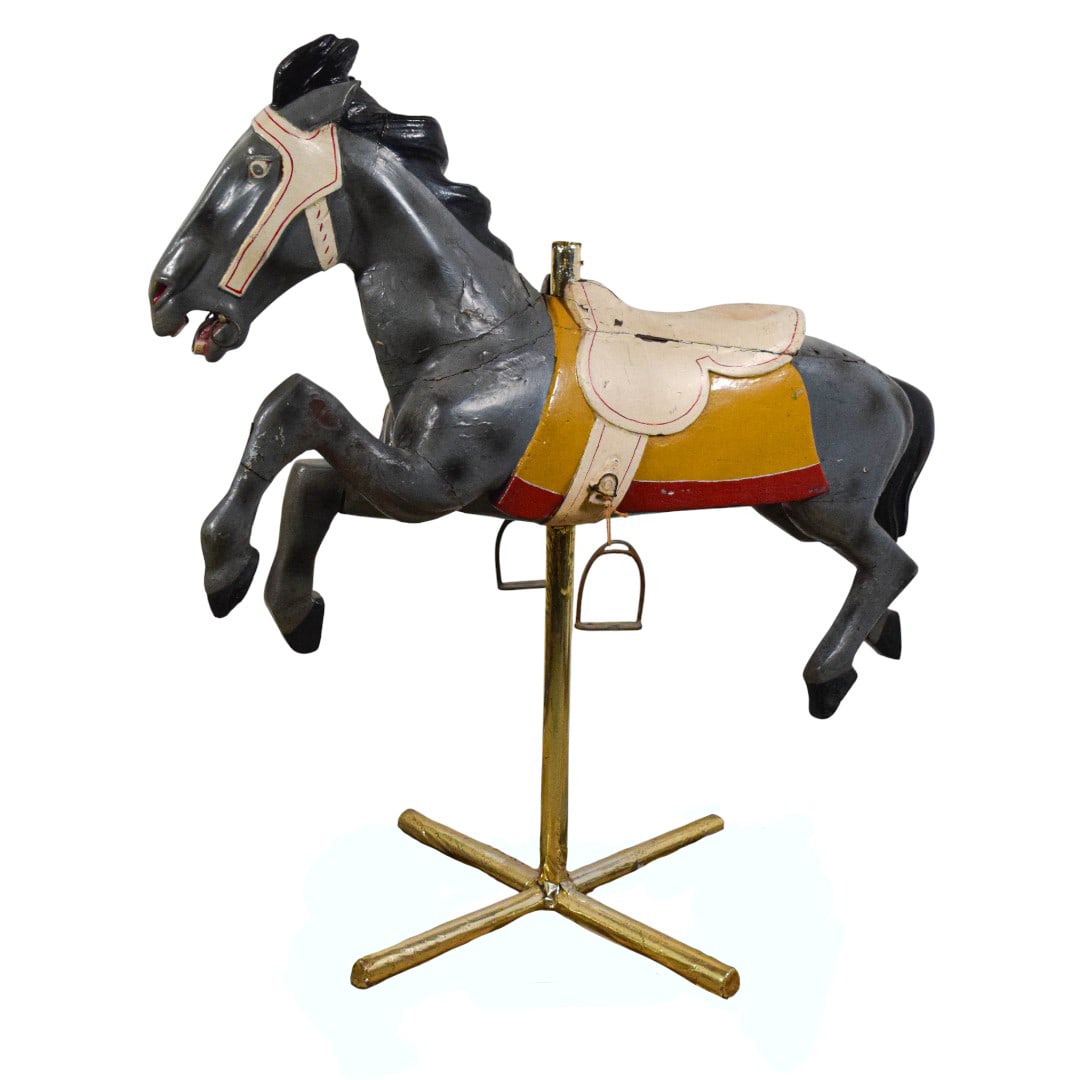 Herschell Style Jumper Wooden Carousel Horse: Wooden Jumper carousel horse, Herschell style, unsigned. Carved and painted wood, metal base. 52"H x 51 1/2"L including stand. Paint loss throughout; chips to wood and cracks throughout, including to