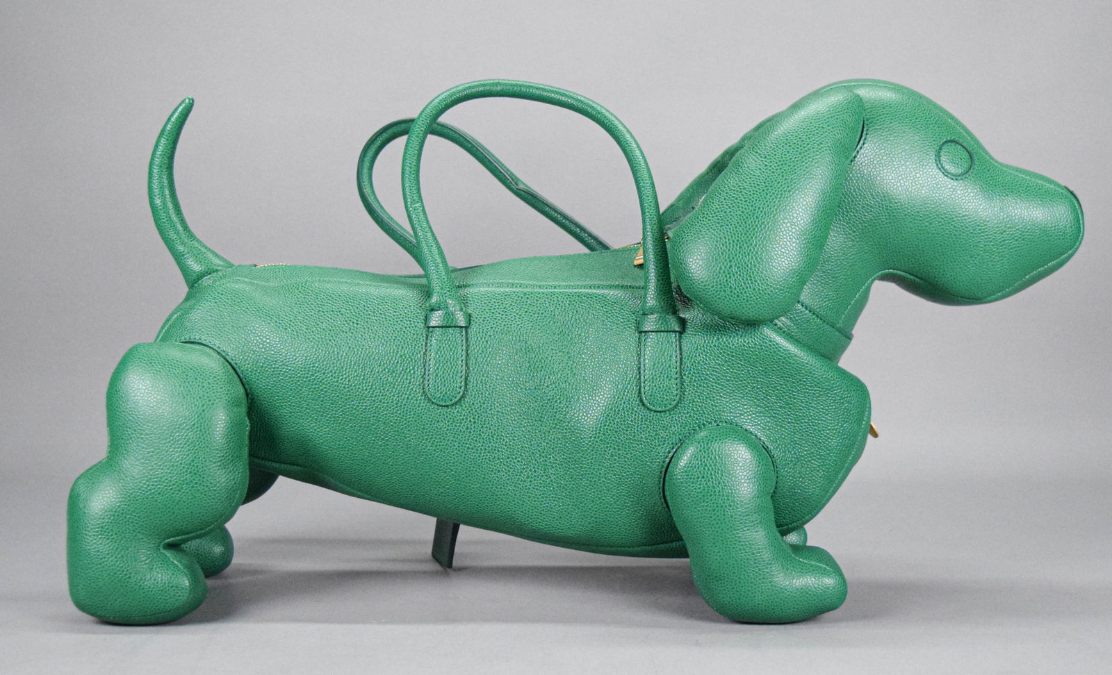 Thom Browne Hector Bag: Thom Browne "Hector" dog handbag. Green leather, with Thom Browne leather luggage tag and brass "Hector Browne" / "If lost please return to Thom Browne" tag. Red, white and blue striped lining with tw