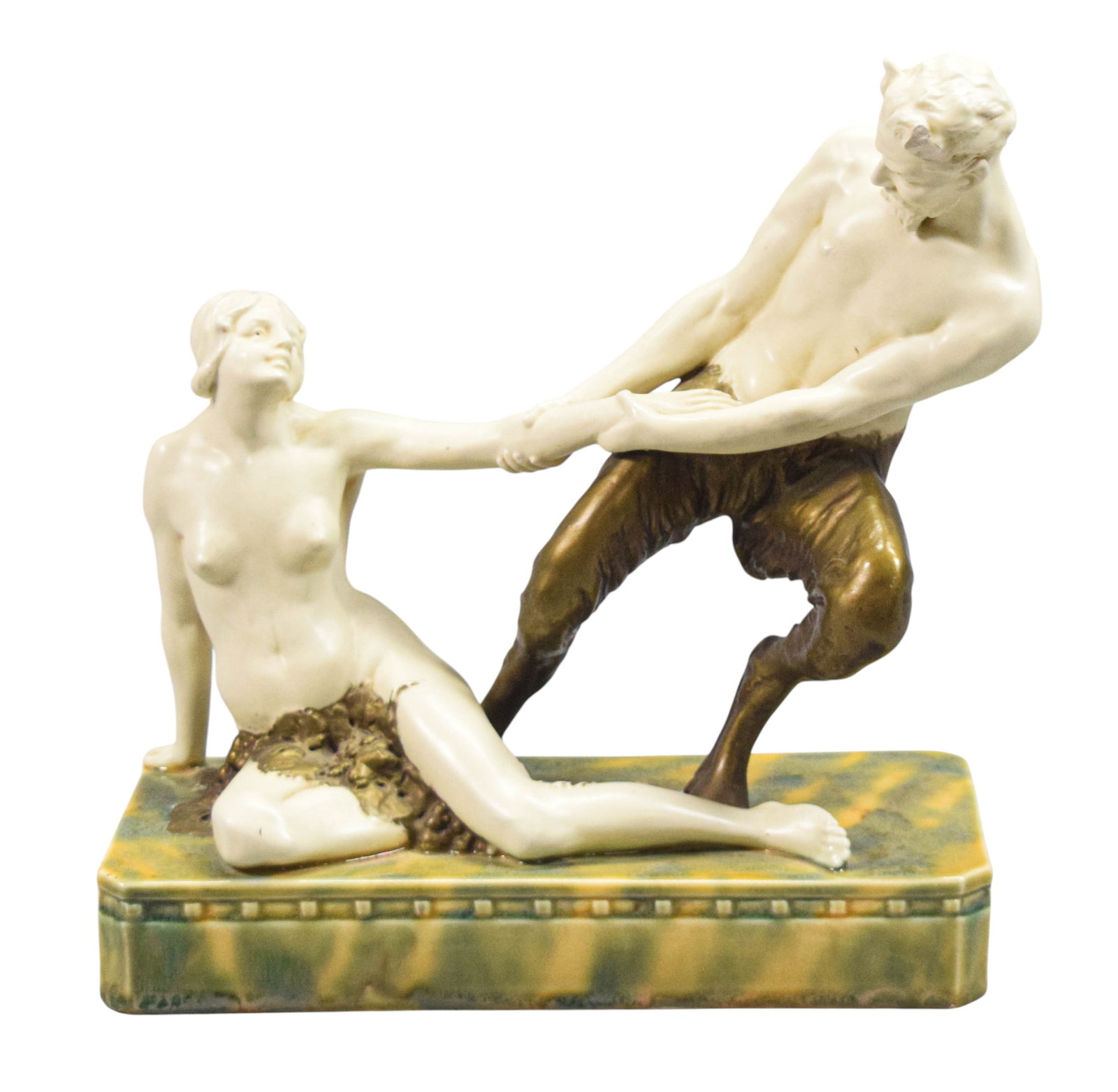 Porcelain Sculpture Satyr & Nude Woman: Glazed porcelain and ceramic sculpture of a satyr and nude woman. Mounted on rectangular base with mottled glaze. Signed O Meier on the base. 9 1/2" H x 9" W x 4" D. Slight crazing to base. Chip and g