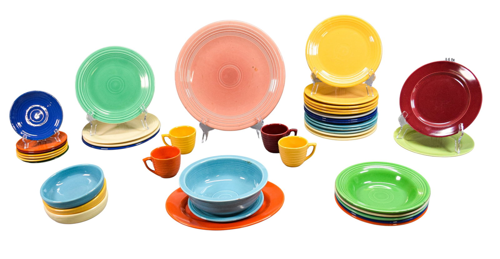42 Pieces Vintage Fiesta & Other Stoneware: 42 pieces vintage Homer Laughlin Fiesta Ware and other stoneware. Unmarked orange oval platter; 5 bowls (green, light green, orange, blue, ivory); 7 saucers in various colors (3 Bauer, 1 Fiesta, 3 unm