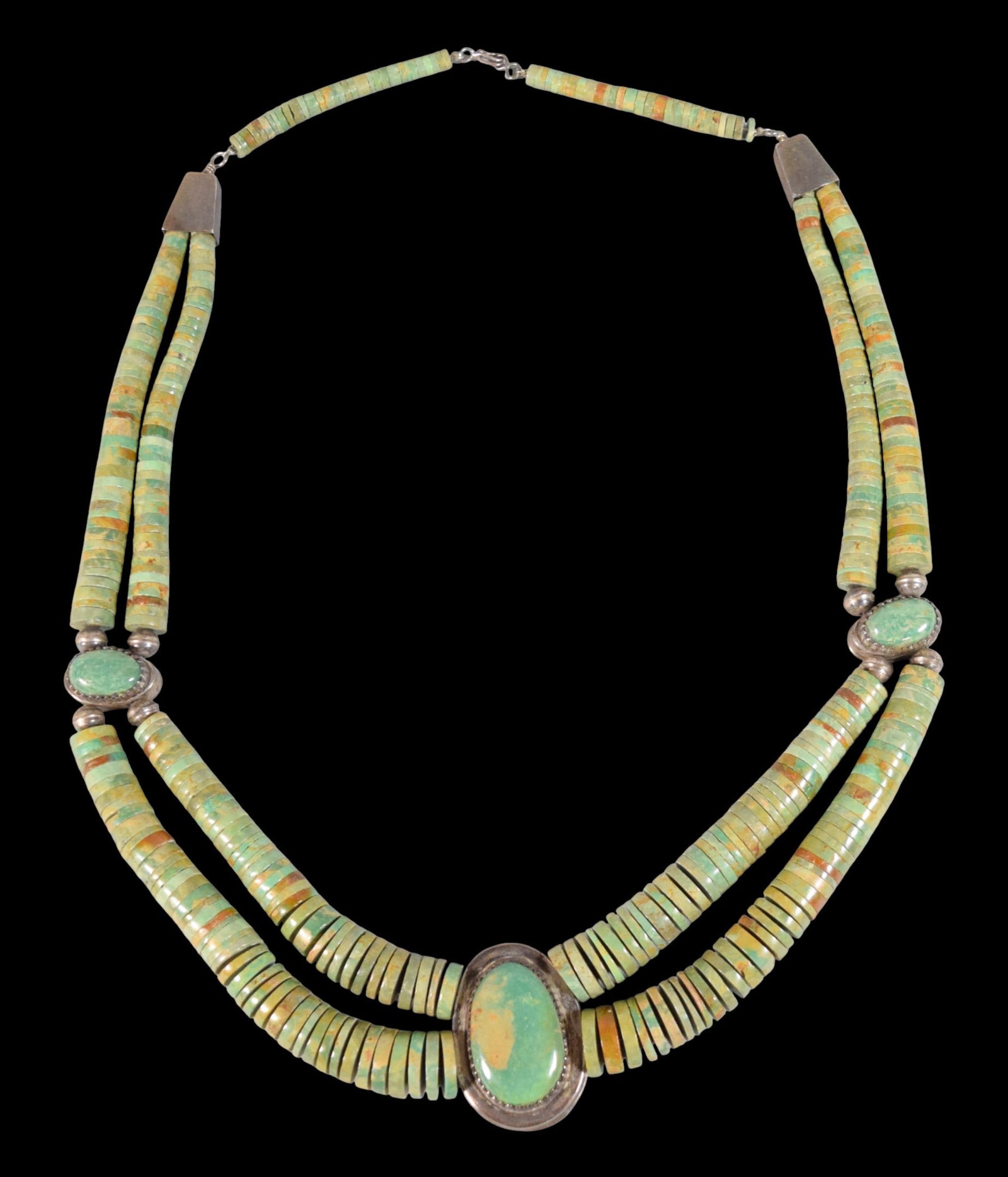Harold Lovato Sterling & Turquoise Bead Necklace: Harold Lovato sterling and turquoise beaded necklace. Two strands of turquoise heishi beads, reversible, with turquoise cabochons and keokopelli. Santo Domingo, signed HL on the clasps. 31 1/2"L (open