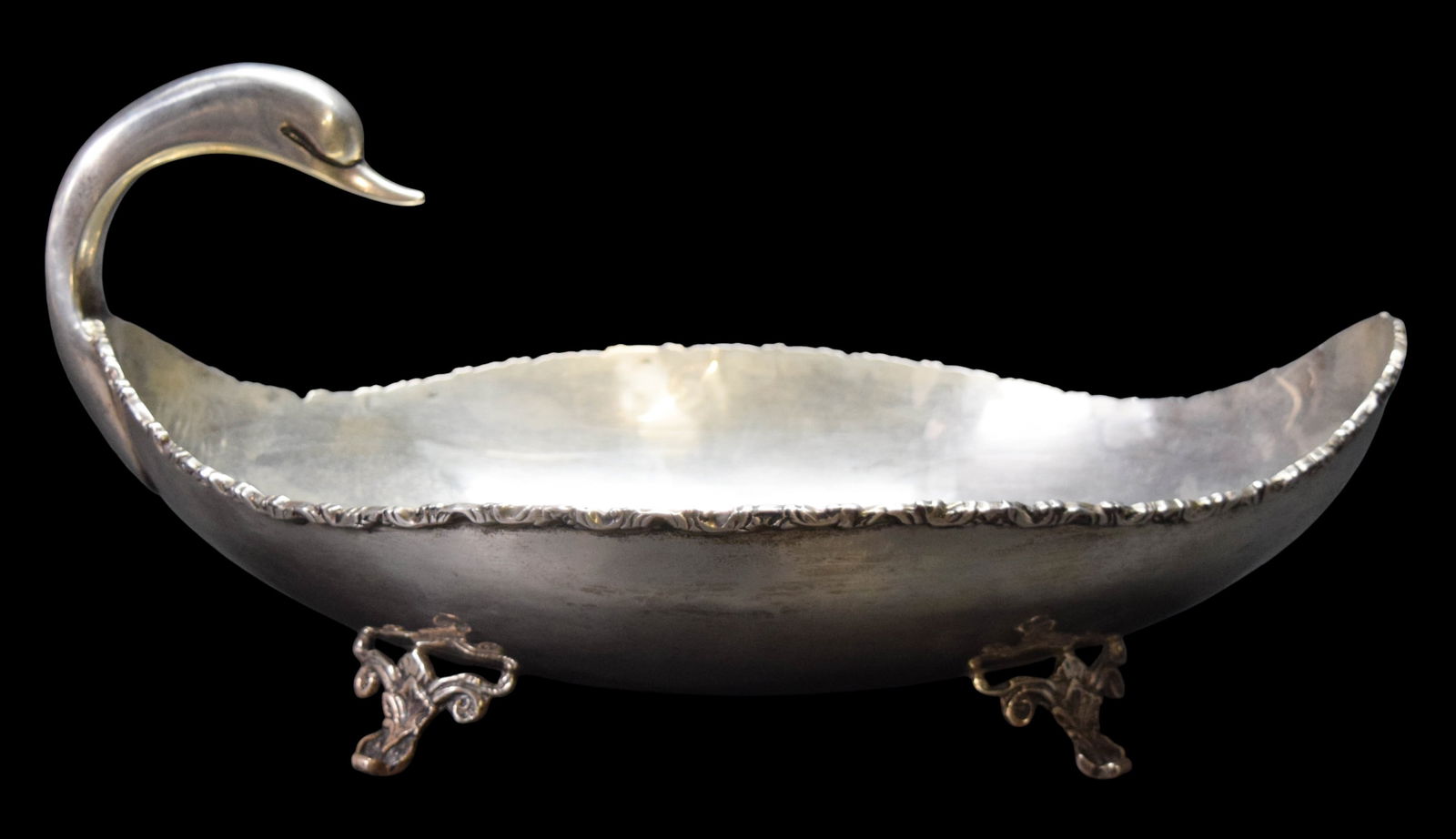 Mexican Sterling Swan Centerpiece Bowl: Hallmarked Mexican sterling silver swan form footed center bowl. Marked on the underside CLS Sterling Made in Mexico and with eagle hallmark. 1348 grams total. 8 1/8"H x 16 1/4"L. Scratches and light