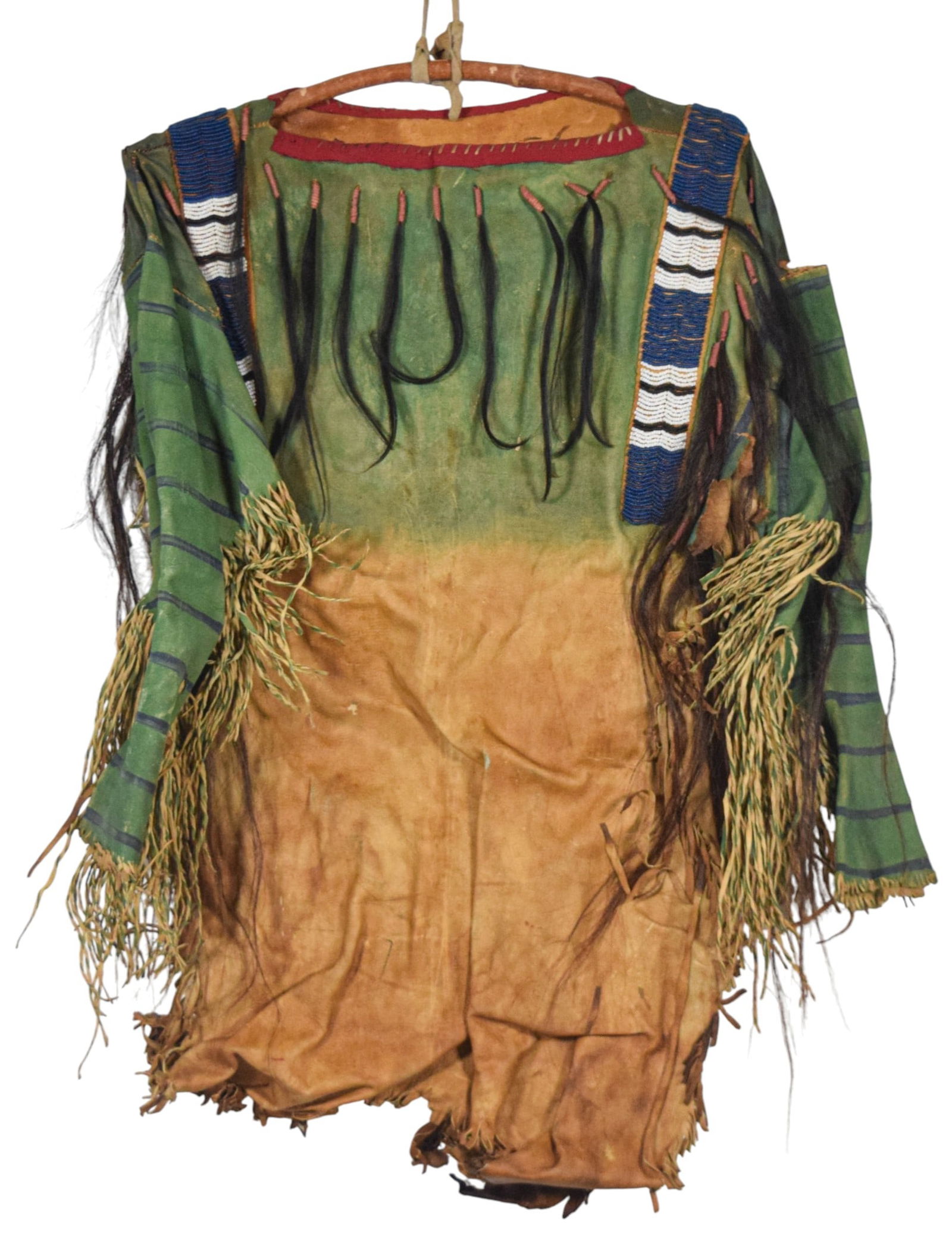 Native American Hide War Shirt: Native American painted hide garment, attributed to North American Plains. Hand-sewn panels with lazy-stitch beadwork throughout shoulders and sleeves. Hide treated with various pigments. Fringes thro