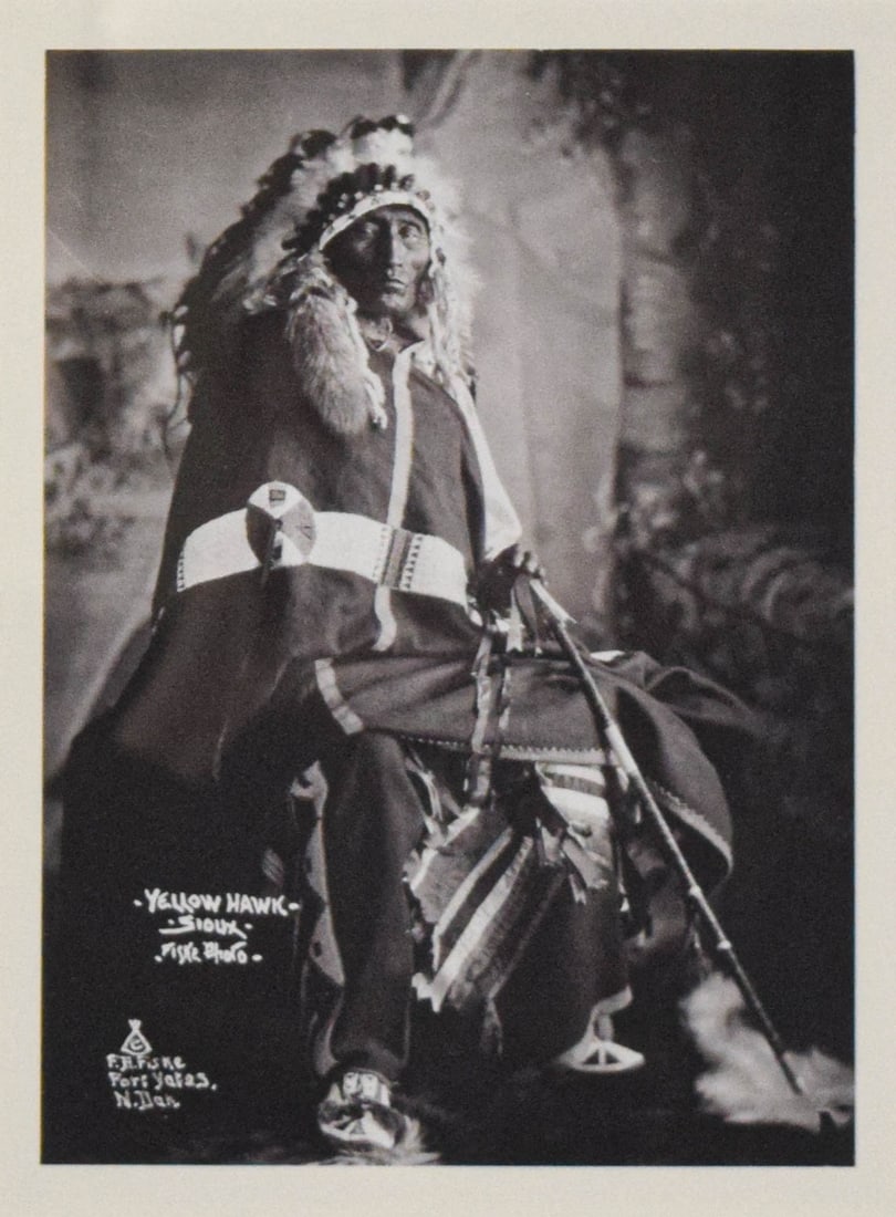 Frank Bennett Fiske Photograph Yellow Hawk Sioux: Frank Bennett Fiske (American, 1883-1952). Photograph, Yellow Hawk - Sioux. Signed lower left with The Squash Blossom, Colorado Springs gallery label on verso. 10" x 7", with frame 18 1/2" x 15". Scra