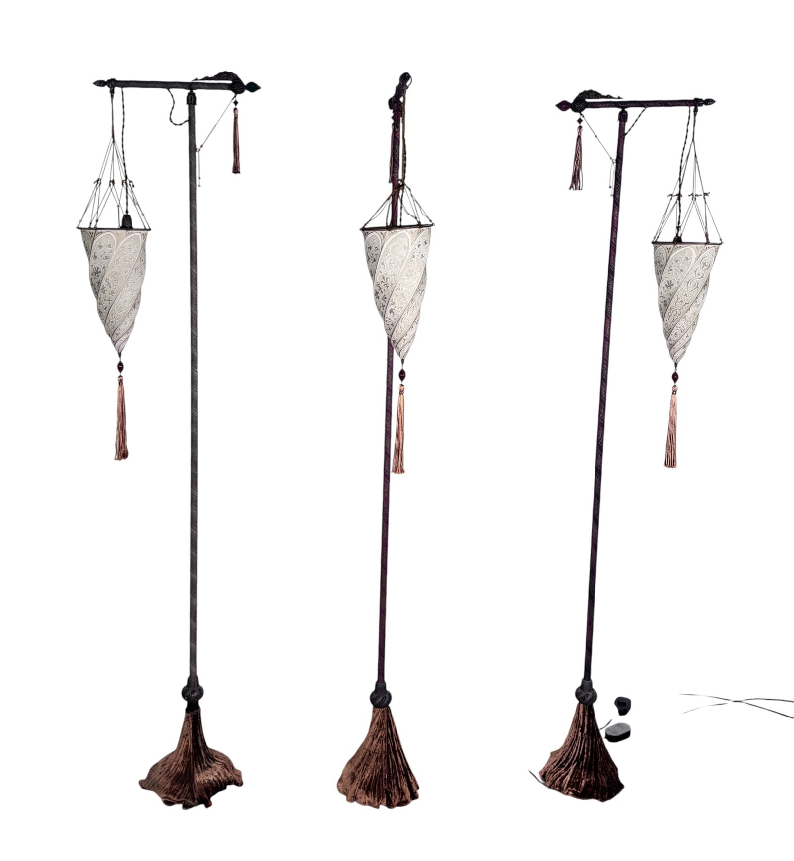 3 Fortuny Cesendello style Floor Lamps: A trio of Fortuny Cesendello floor lamps with Venetia Studium shades. Each lamp is constructed with a tall, slender pole wrapped in patterned and solid-colored fabrics, topped with an ornate metal cro