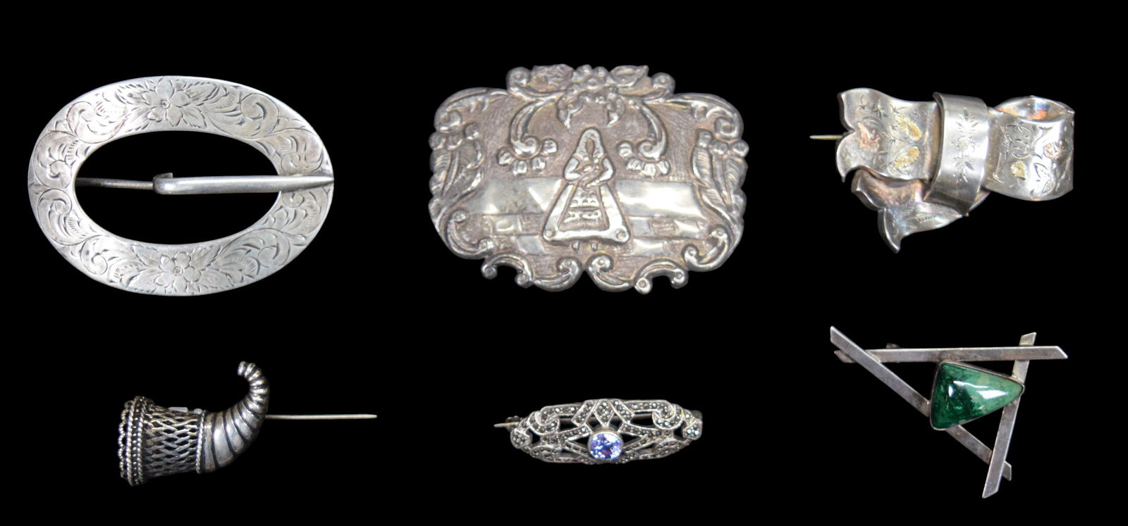 6 Sterling Brooches Unger Bros., Eliat: 6 sterling silver brooches. Eliat modernist brooch signed AW, Unger Brothers with floral motif, brooch with standing woman, bow, brooch with marcasite and CZ, cornucopia. Unger Bros. 2 5/8"L. 69.7 gra