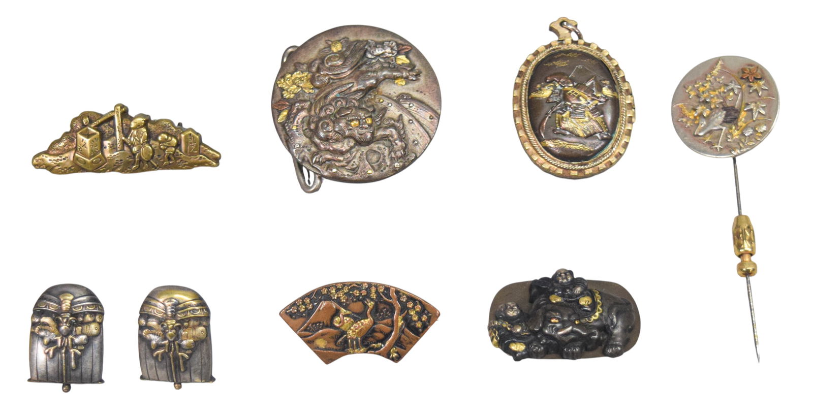 8 Pieces Japanese Sword Jewelry: 8 Japanese sword components mounted as jewelry. Menuki mounted as pair of cufflinks, stick pin, buckle, locket, 3 brooches. Brass, bronze and other metals. Buckle 1 3/4"-diameter. 1 brooch missing pin
