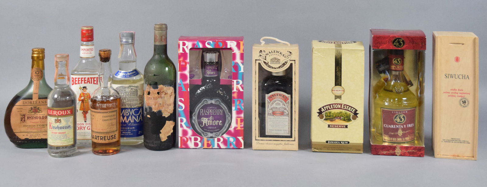 11 Vintage Spirits and Liqueurs, c. 1960-2010: This diverse assembly of international spirits and liqueurs features a range of vintage and contemporary bottlings, showcasing various distillation styles and regional specialties. The collection incl