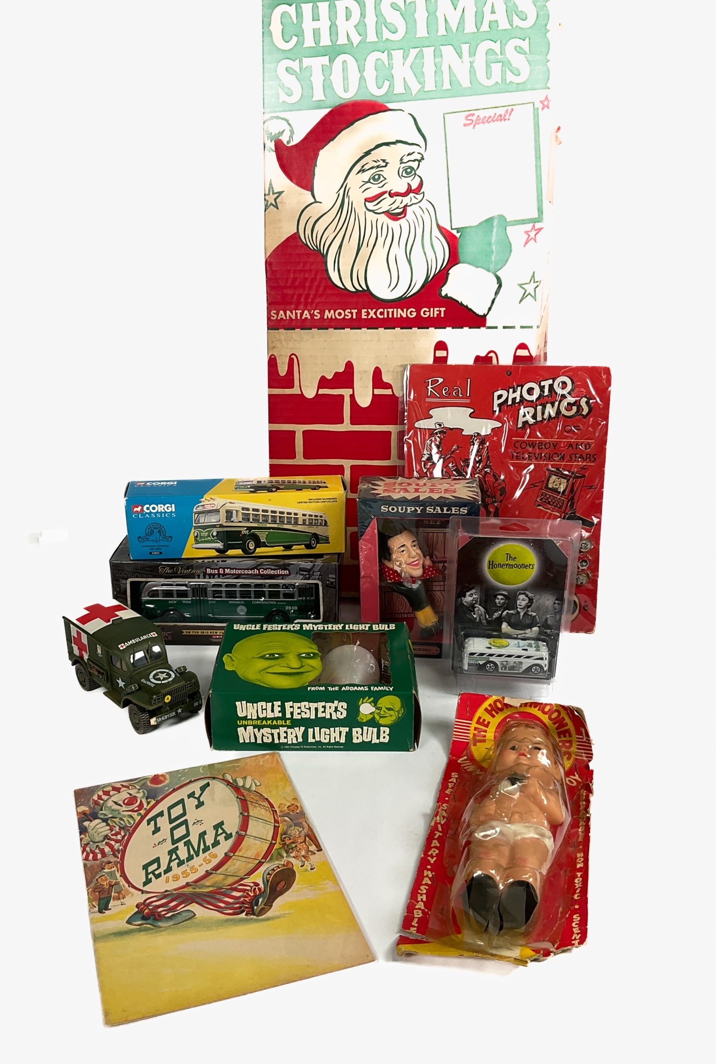 10 Vintage Children's Toys & Collectibles: Group of 10 vintage children's toys and collectibles. Tons-O-Fun toy-filled Christmas stocking by Lawrence Industries c. 1960s. Soupy Sales rubber clip-on doll. Cardboard-backed "Photo Rings of C