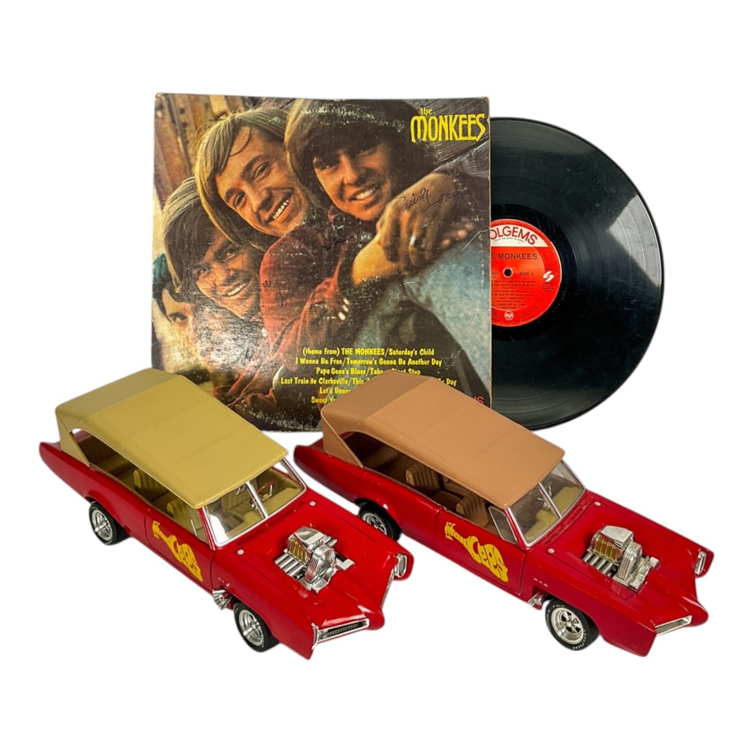 The Monkees Signed Record & 2 Ertl Monkee Mobiles: Group of The Monkees memorabilia including a signed The Monkees record and 2 Ertl 1966 Pontiac GTO 1:18 scale "Monkee Mobiles." Vehicles designed by George Barris for the 1960s television sh