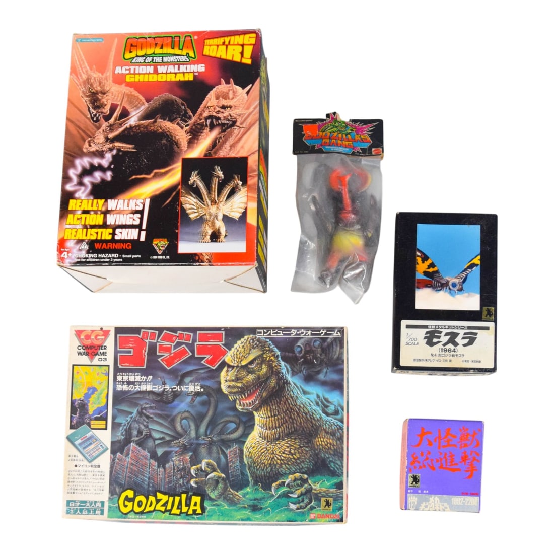 Vintage Godzilla Kaiju Figure & Model Collection: Group of vintage Godzilla-themed collectibles featuring figures, models, and games. Includes a 1994 Trendmasters Action Walking Ghidorah; a 1978 Mattel Godzilla's Gang Megalon vinyl figure; a 1964 Aos