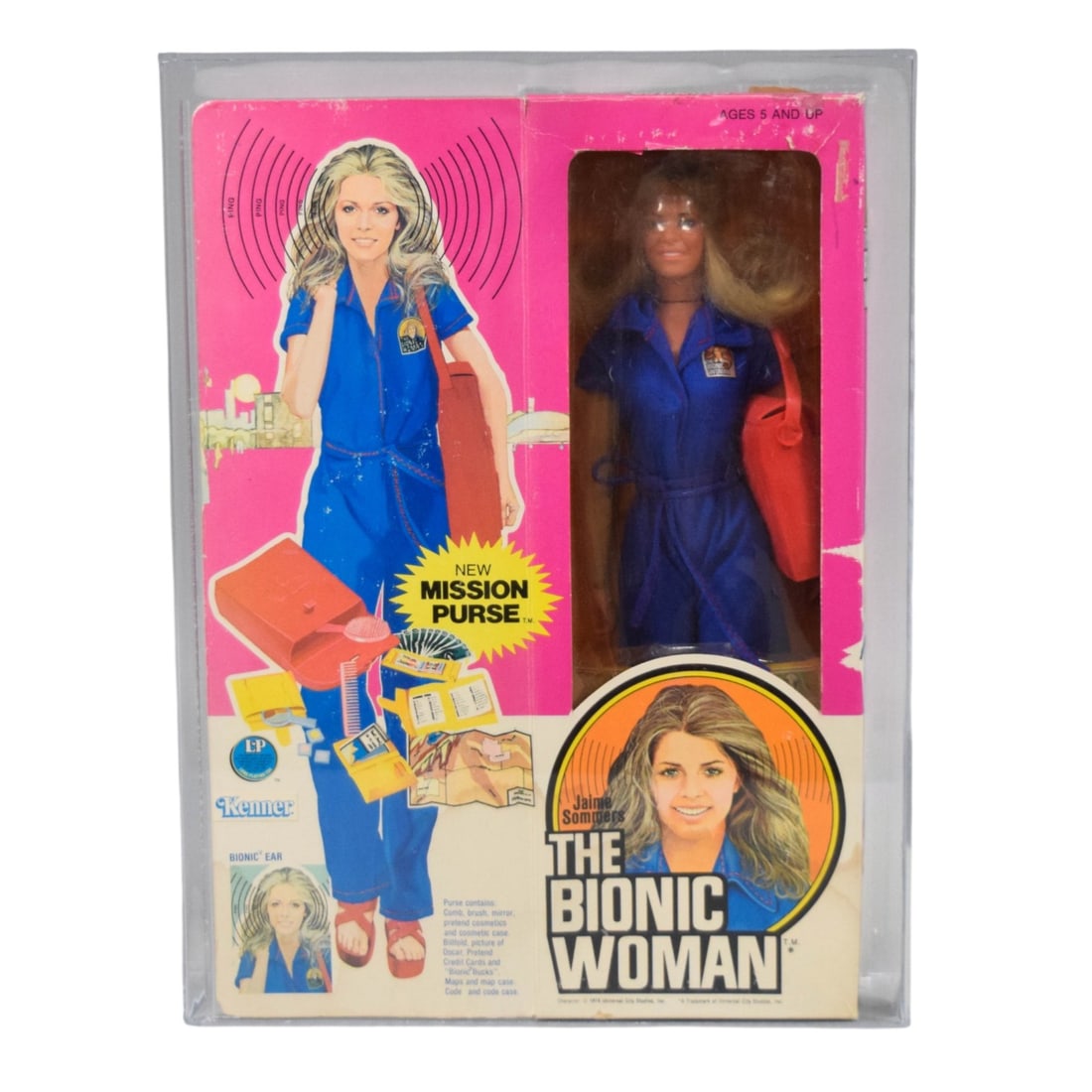 Kenner 1977 The Bionic Woman Jaime Sommers 12-Inch Action Figure AFA 70: Kenner 1977 "The Bionic Woman" Jaime Sommers with Mission Purse 12-inch action figure. The figure is constructed of plastic with a fabric jumpsuit and is housed in its original cardboard and plastic w