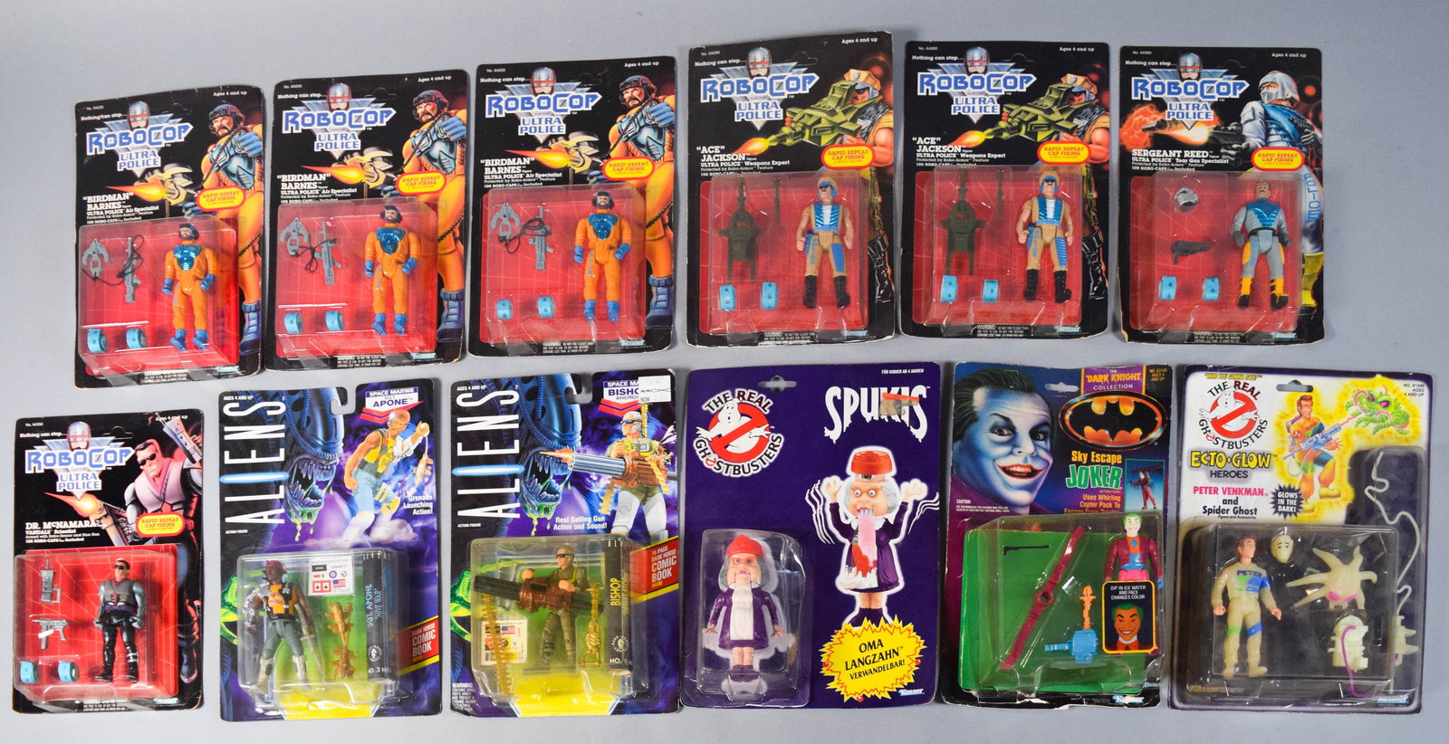 12 Vintage Kenner Action Figures Incl RoboCop, Aliens, and Ghostbusters: Collection of 12 factory-sealed vintage action figures manufactured by Kenner c. 1988-1992. Includes seven figures from RoboCop and Ultra Police; two Aliens figures; two Ghostbusters figures; and one
