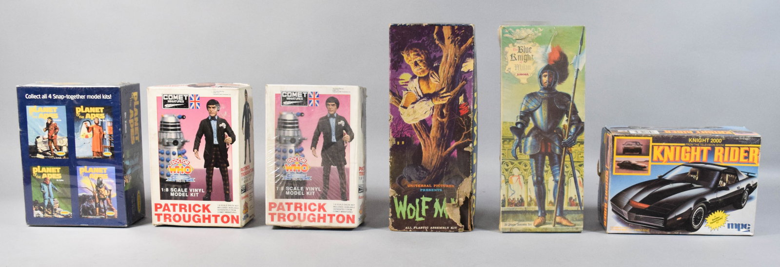 6 Vintage Character and Vehicle Model Kits by Aurora, Comet Miniatures, and MPC: Six vintage model kits featuring characters and vehicles from film, television, and history. The group includes an Aurora Planet of the Apes Dr. Zaius Snap-together All Plastic Assembly Kit in its ori