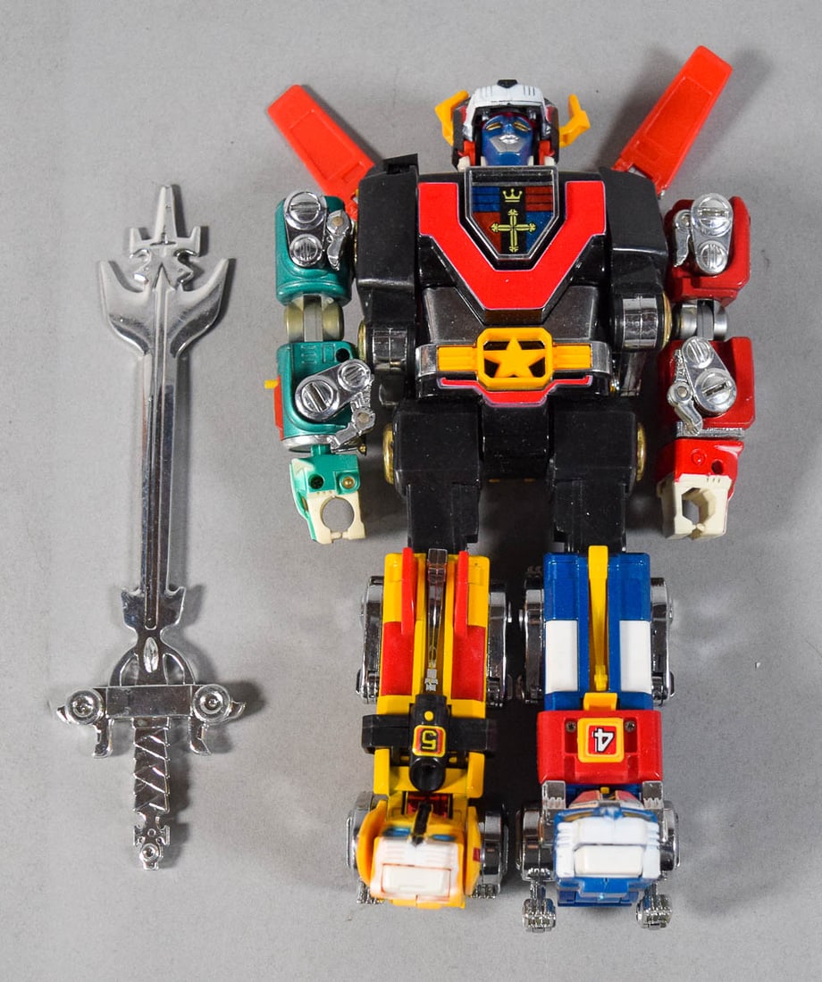 Vintage Voltron Lion Force Combining Robot Action Figure with Blazing Sword: Vintage multi-piece combining robot action figure, commonly identified as Voltron from the Defender of the Universe franchise. This figure is designed in the style of the mid-1980s Lion Force series p