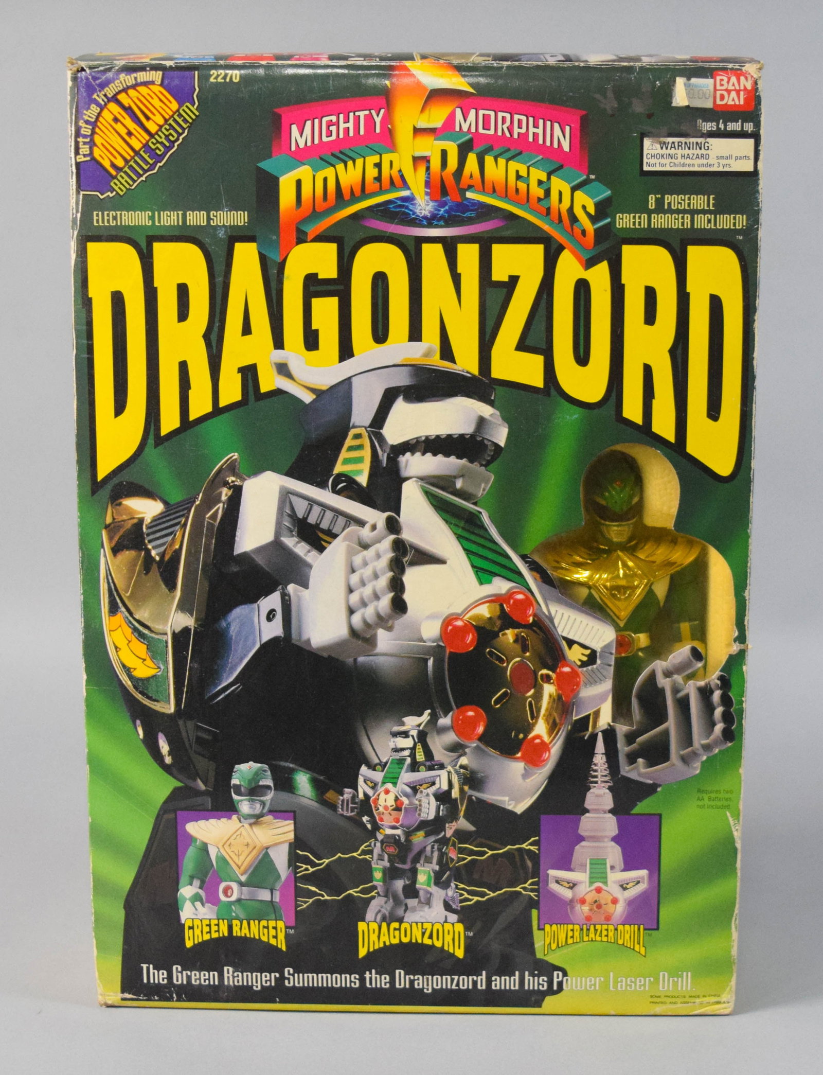 Bandai Mighty Morphin Power Rangers Dragonzord and Green Ranger Figure Set: Vintage Mighty Morphin Power Rangers Dragonzord toy set manufactured by Bandai. The set is contained within its original illustrated cardboard box and includes a Dragonzord figure featuring electronic