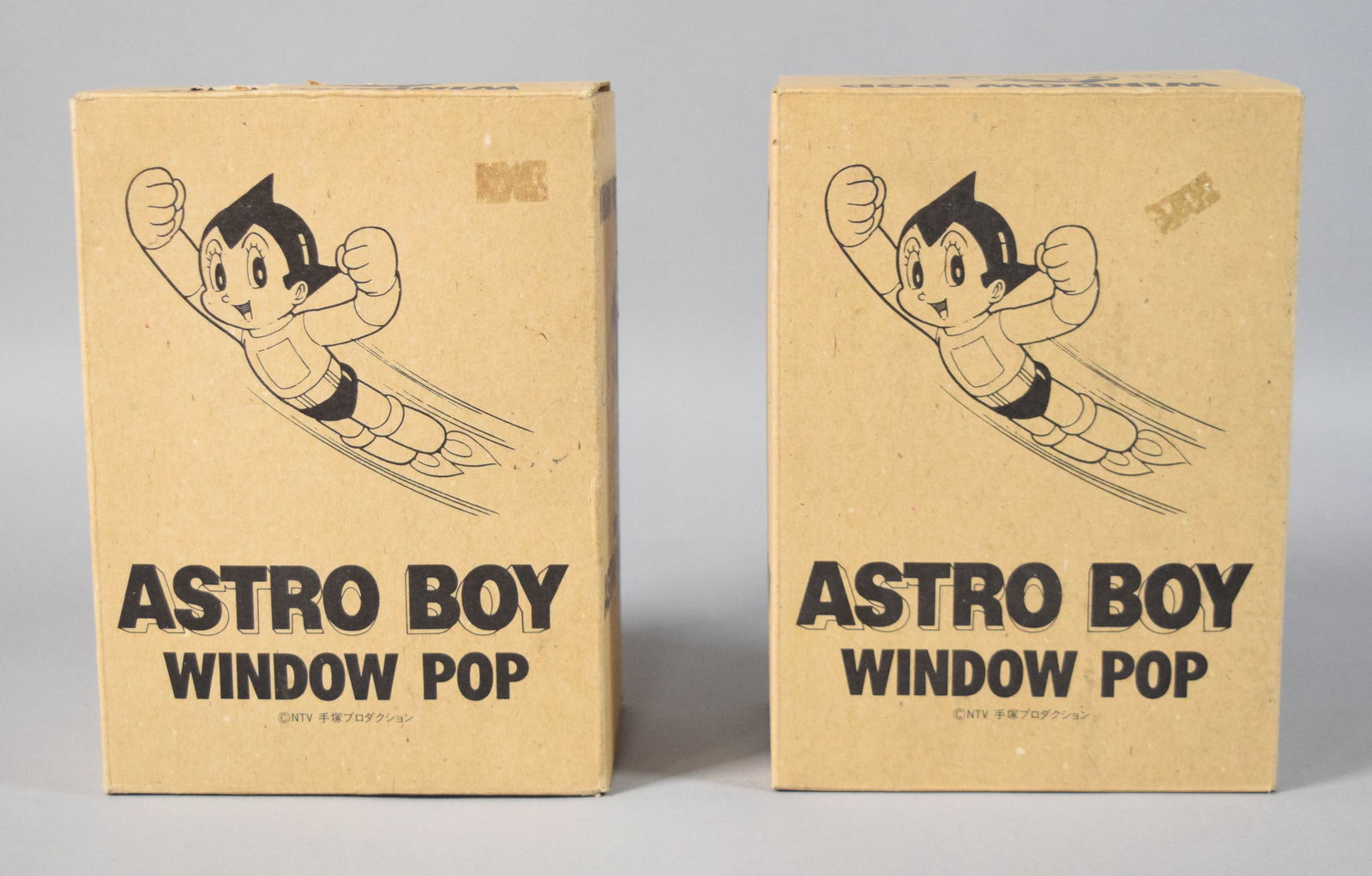 2 Horizon Astro Boy Window Pop Vinyl Figure Sets: Two Astro Boy Window Pop collectible vinyl figure sets produced by Horizon. Each set includes two vinyl figure components consisting of an upper torso with raised arms and a lower section with rocket