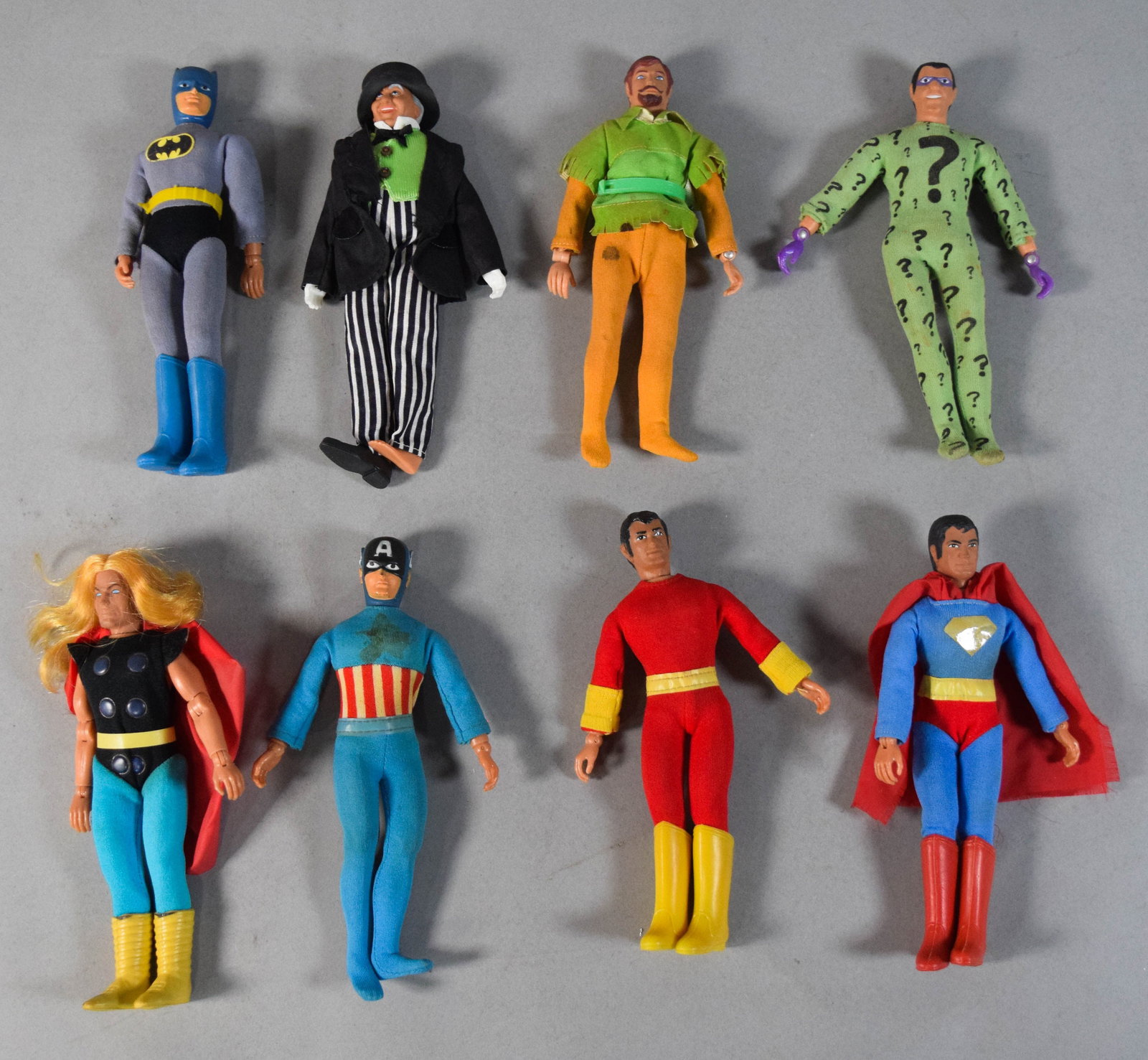 8 Vintage Superhero Action Figures (Attributed to Mego) c. 1970s: Collection of eight vintage 8-inch action figures produced in the style of the Mego World's Greatest Super-Heroes line. The assembly features characters from both the DC and Marvel universes, includin
