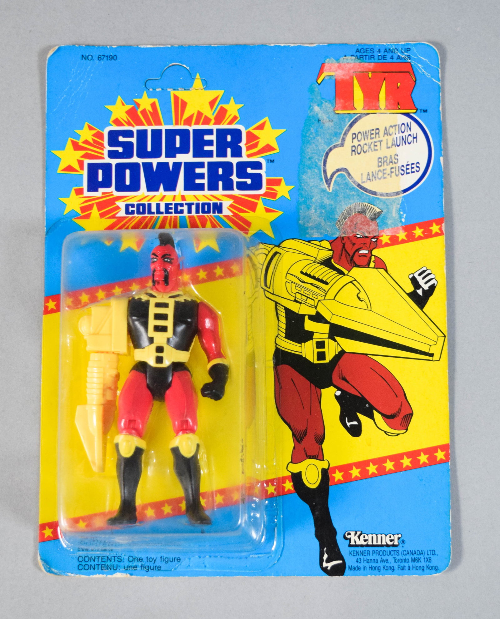 Kenner Super Powers Tyr Action Figure 1985: 1985 Kenner Super Powers Collection Tyr action figure on a 33-back bilingual English and French blister card. Cardback 10" H x 7" W.