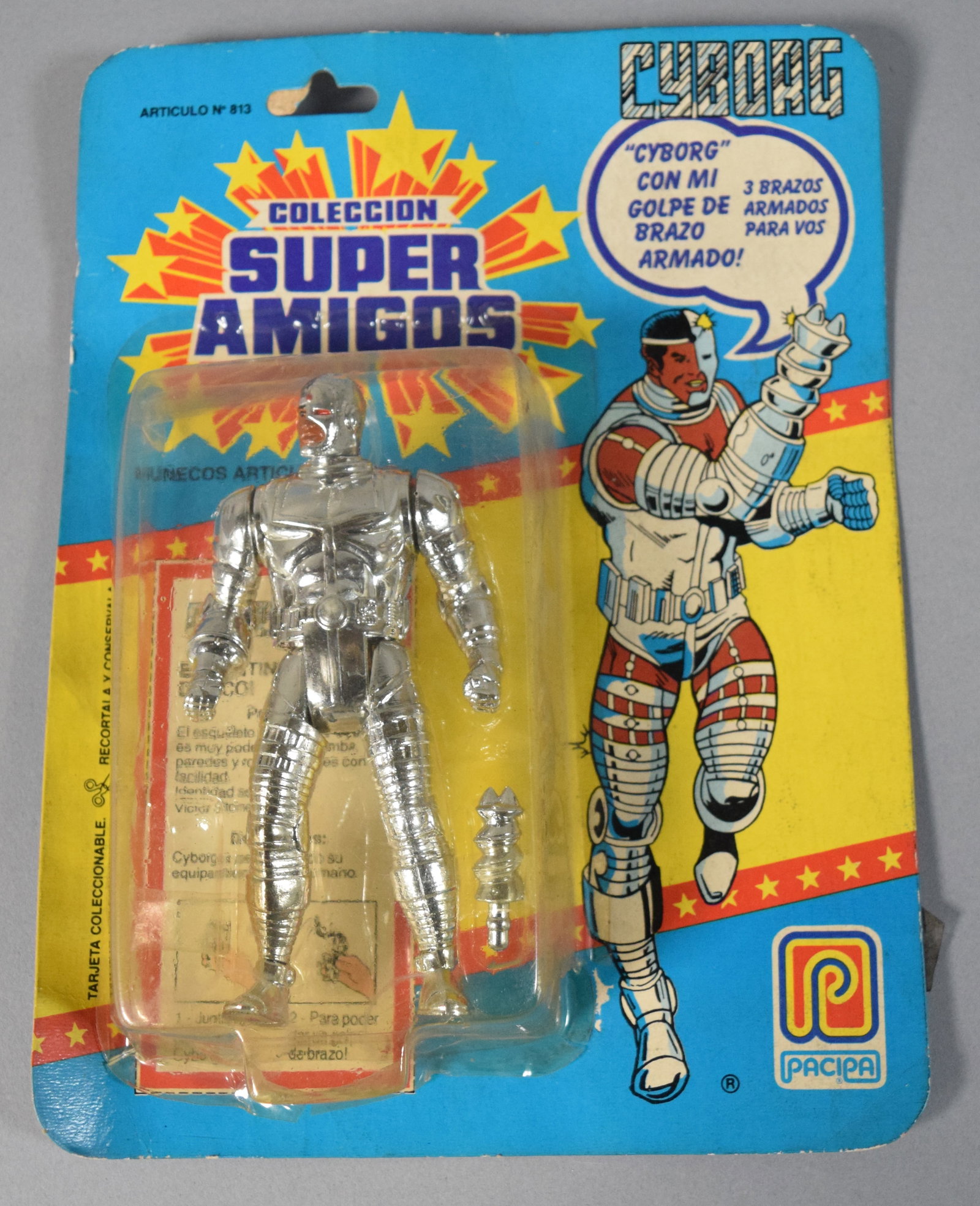 Pacipa 1989 Super Amigos Cyborg Action Figure: Vintage DC Comics Cyborg action figure from the Coleccion Super Amigos line manufactured by PACIPA in 1989. Factory-sealed in original blister packaging on printed cardback. 10" H x 8" W x 1.5" D.