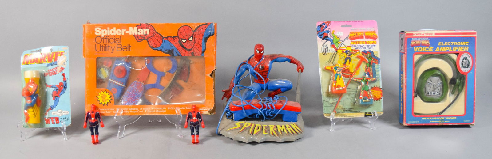 7 Marvel Super Heroes Toys and Electronics c. 1979-1990: Group of seven vintage Marvel Super Heroes themed toys and electronics. Includes a 1979 Remco Spider-Man Official Utility Belt in its original window box, featuring various plastic accessories includi