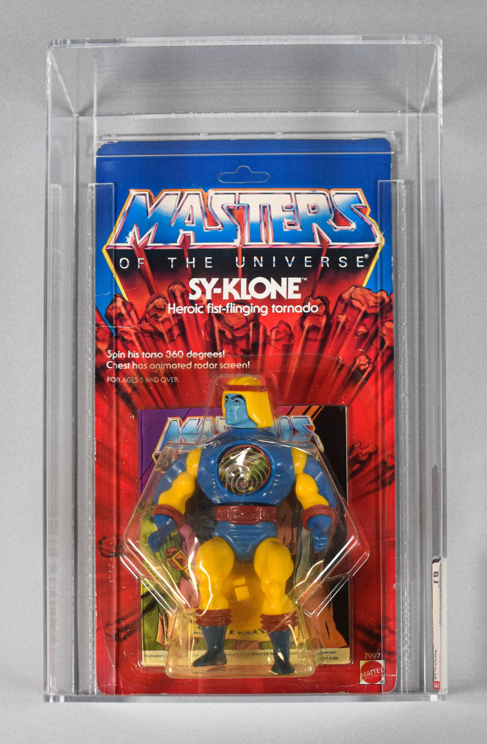 Mattel 1985 MOTU Sy-Klone AFA 75: 1985 Mattel Masters of the Universe (MOTU) Series 4 Sy-Klone action figure, factory-sealed on the original card. Stored in clear acrylic display case with AFA (Action Figure Authority) label. Overall