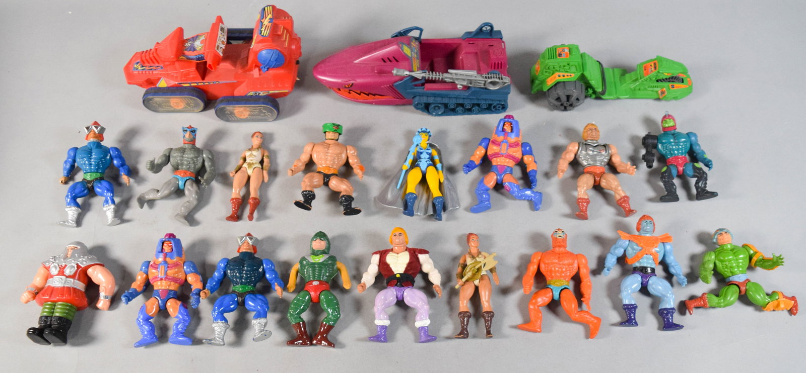20 MOTU Action Figure and Vehicle Collection c. 1980s: Collection of 20 pieces from the original Masters of the Universe (MOTU) line produced by Mattel. The lot features a variety of articulated action figures and three specialized vehicles. Notable figur