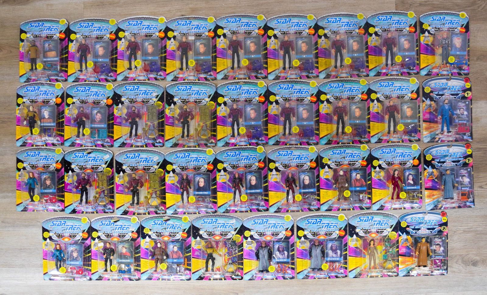 35 Star Trek The Next Generation Action Figures c. 1992-1994: Collection of 35 individual action figures from the Star Trek: The Next Generation line, manufactured by Playmates Toys in the early 1990s. The assortment includes the primary bridge crew such as Capt