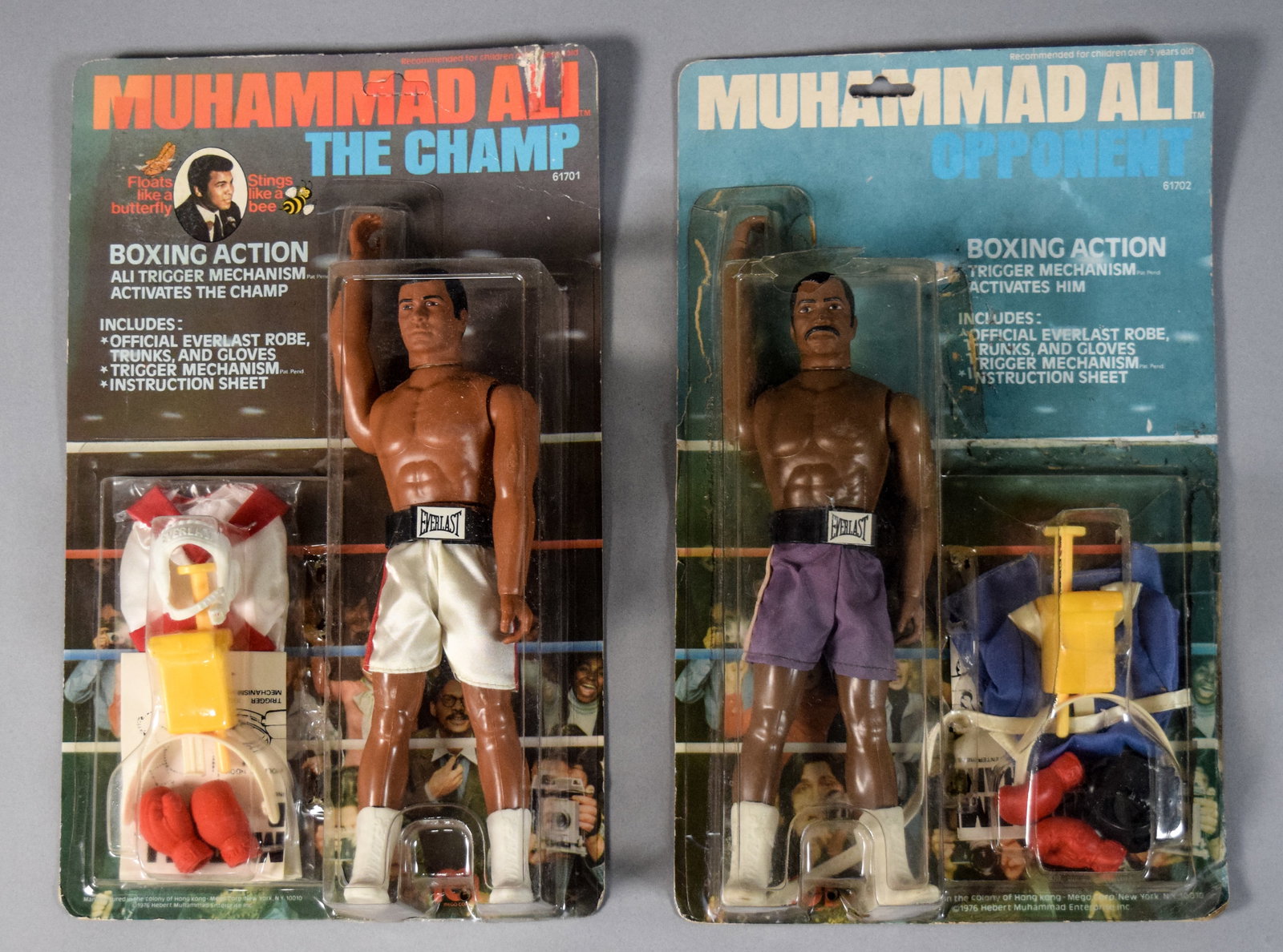 2 Vintage Mego Muhammad Ali The Champ and Opponent Action Figures 1976: Twp vintage Muhammad Ali-themed action figures manufactured by Mego in 1976. The set consists of The Champ (model 61701), depicting Muhammad Ali, and the Opponent figure (model 61702). Both figures ar