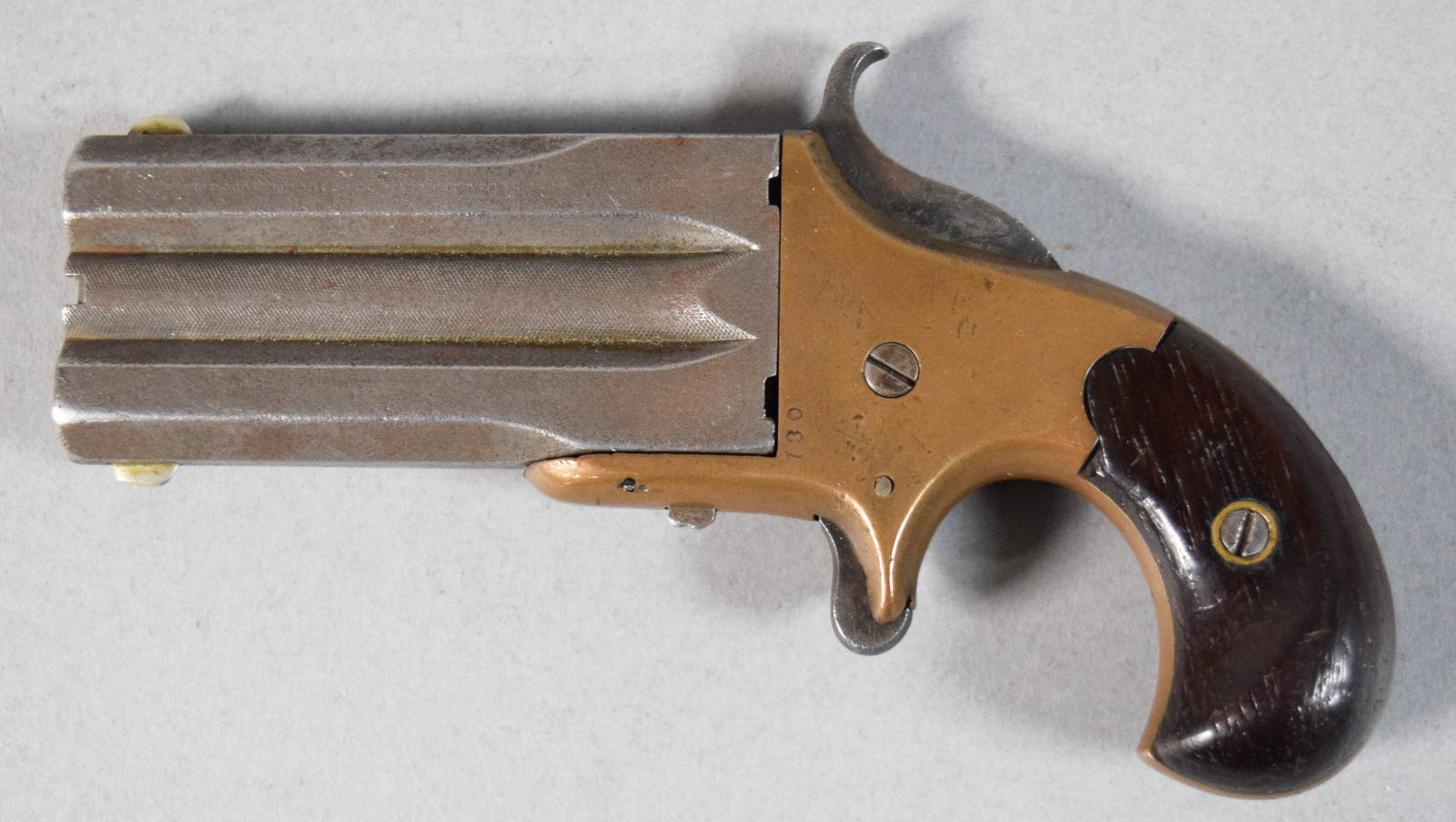 Mid-19th Century Three-Barrel Pocket Pistol: Mid-19th century three-barrel brass and steel pocket pistol, attributed to William W. Marston. Single-action hammer, spur trigger, and sliding selector switch on the right side of the barrel. Left sid