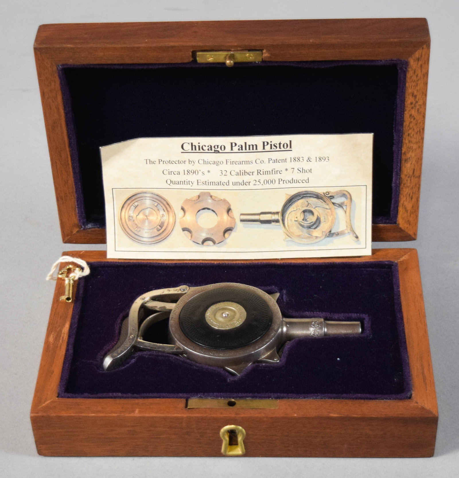Chicago Firearms Co. Protector Palm Pistol in Fitted Case: Late 19th century Chicago Firearms Co. "The Protector" concealable palm pistol. Circular-design pistol chambered for .32 caliber rimfire cartridges with a 7-shot internal rotary magazine. Marked Chica