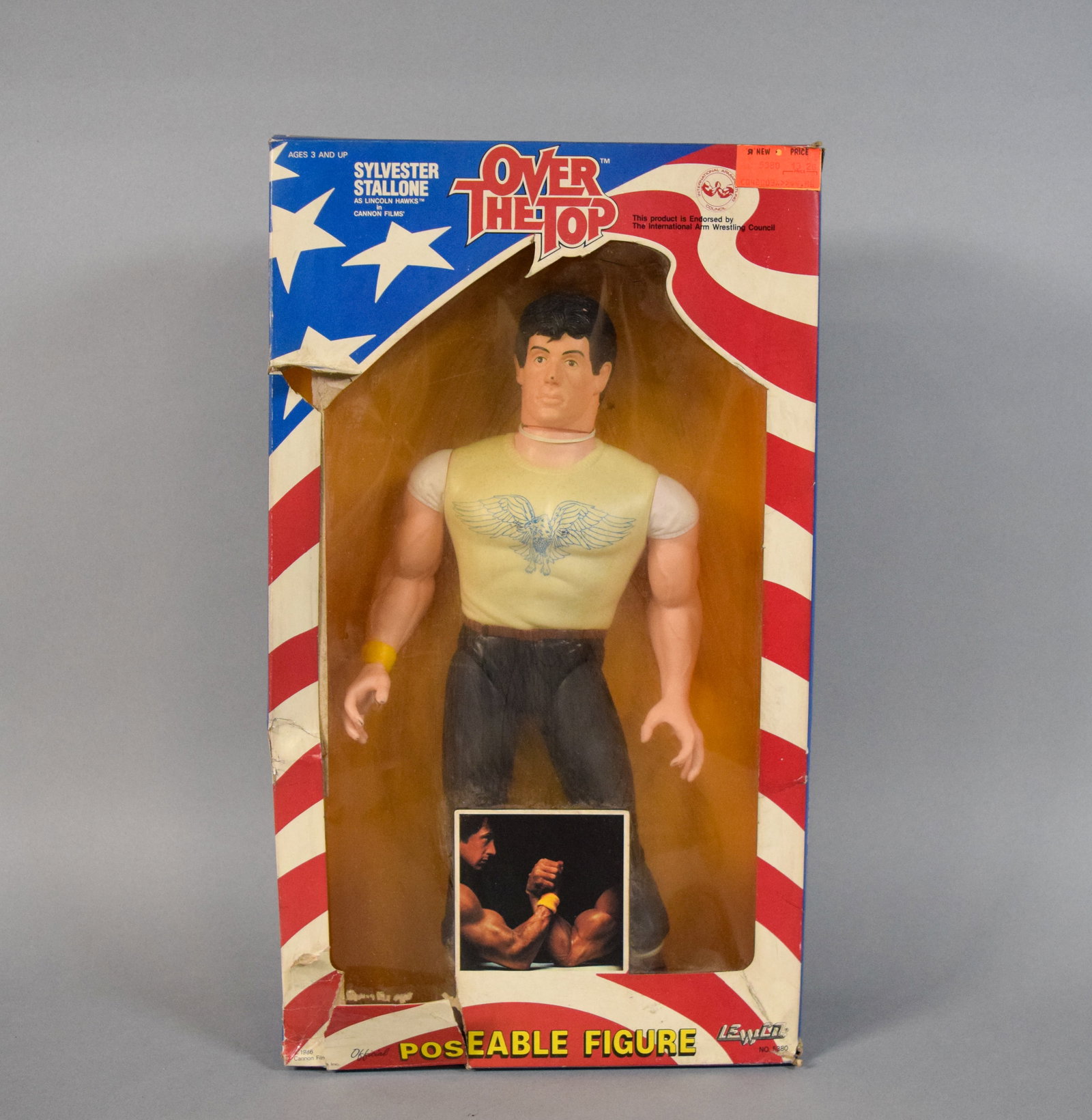 Lewco 1986 Sylvester Stallone Lincoln Hawks Poseable Figure in Original Box: Vintage poseable action figure depicting Sylvester Stallone as the character Lincoln Hawks from the 1987 Cannon Films production Over the Top, manufactured by Lewco in 1986. 19 1/2" H x 11" W x 4" D.