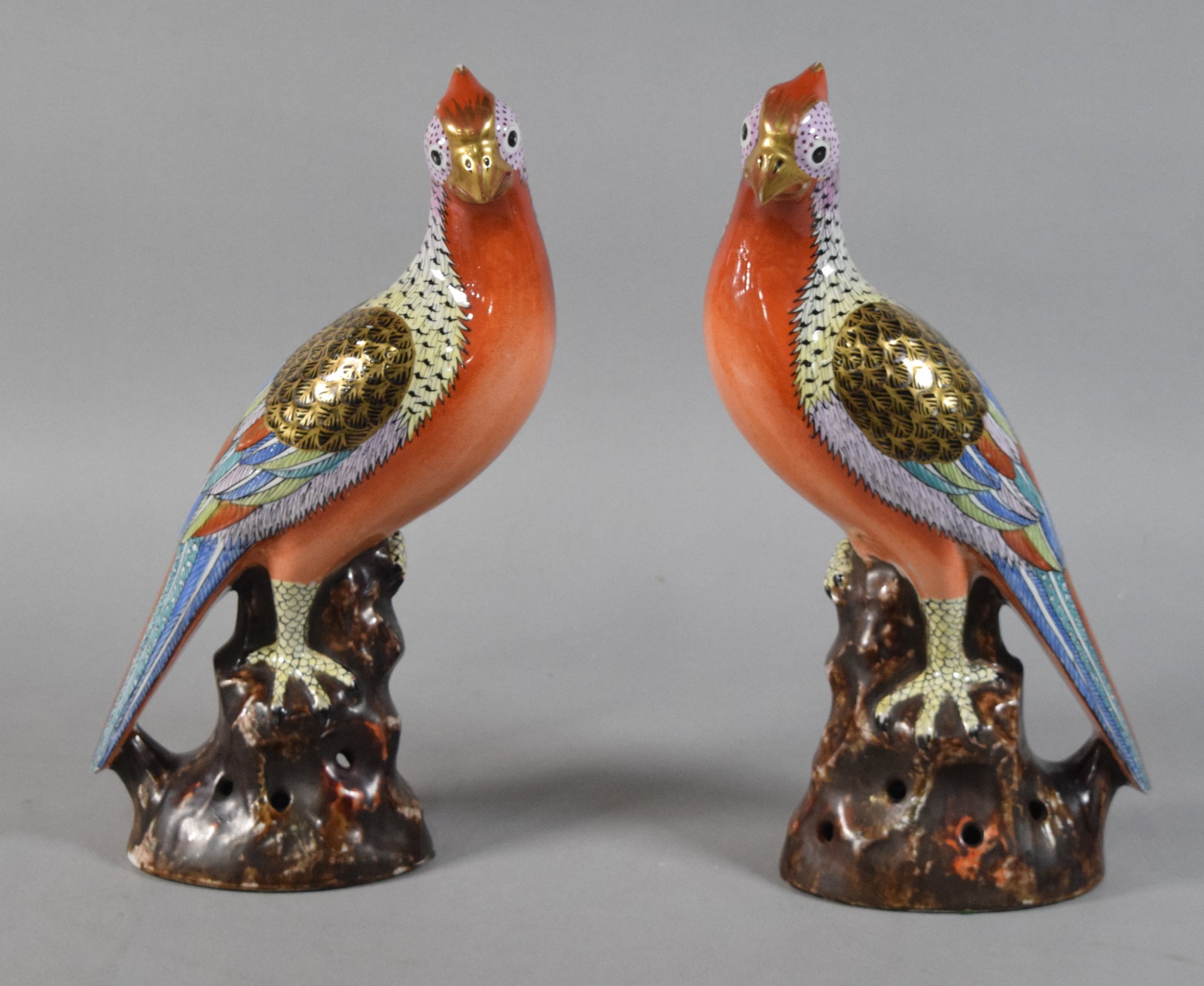 Pair of Large Polychrome Glazed Ceramic Pheasants: Pair of large polychrome glazed ceramic bird figurines in the style of traditional Chinese export porcelain pheasants. Bases are hollow with an unglazed interior. Both appear unsigned. Each 15" H x 10