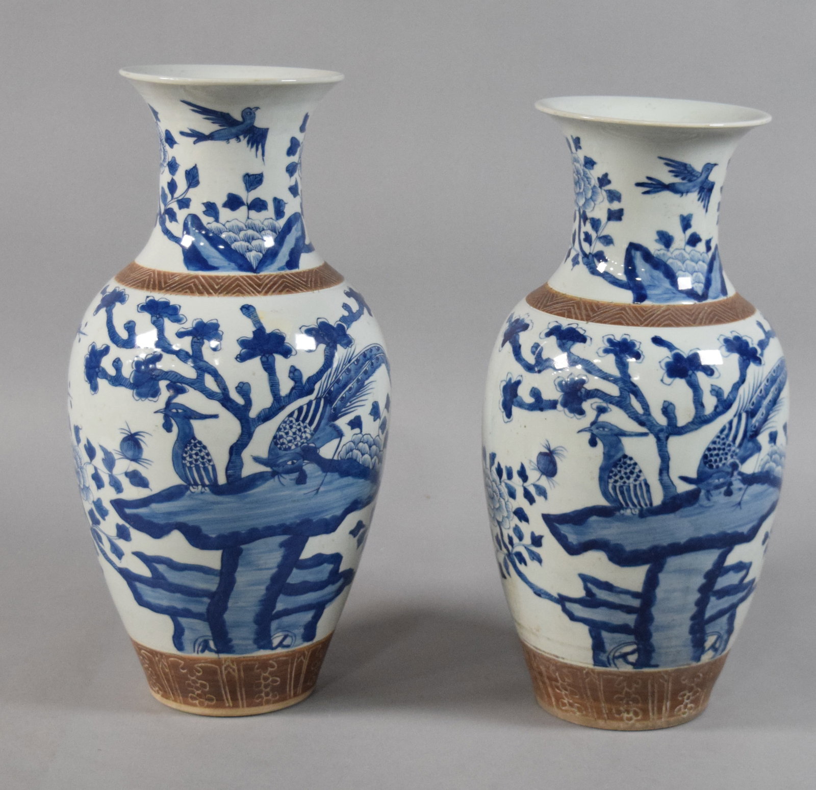 Pair of Chinese Blue and White Porcelain Vases: Pair of Chinese blue and white porcelain baluster vases. Late 19th or early 20th century. Underside of each marked Da Qing Kangxi Nian Zhi. 16" H x 9" diameter.
