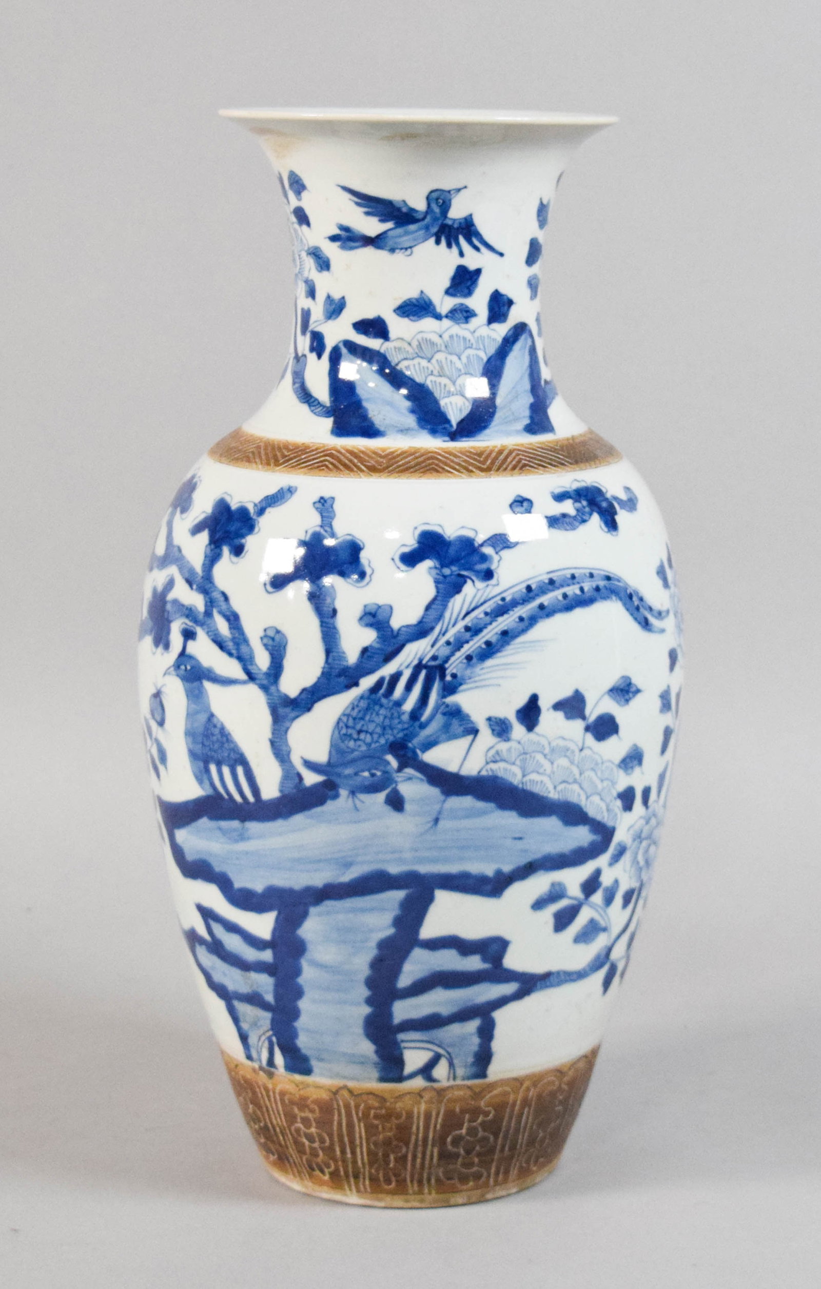 Chinese Blue and White Porcelain Vase: Chinese blue and white porcelain baluster vase. Late 19th or early 20th century. Character mark on the underside reading Da Qing Kang Xi Nian Zhi.