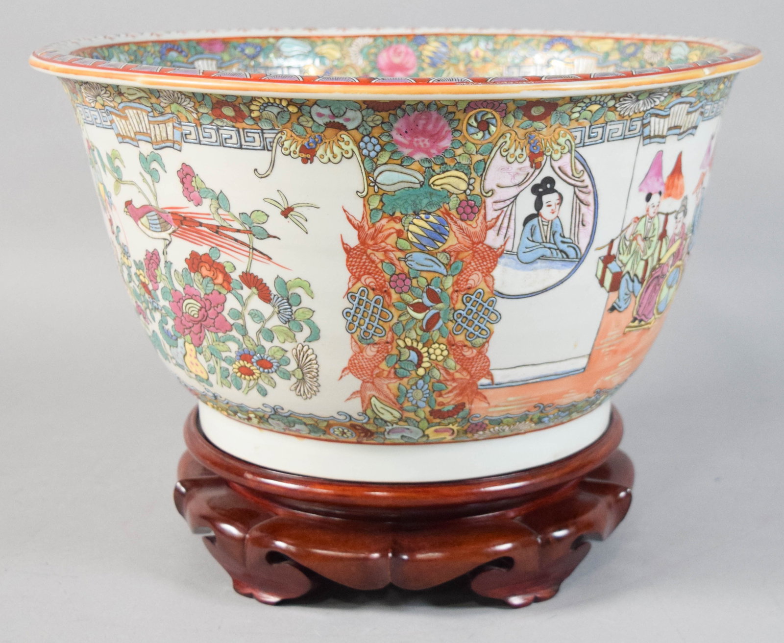 Large Chinese Rose Medallion Porcelain Jardiniere with Wood Stand: Large Chinese porcelain jardiniere with wood stand decorated in the Famille Rose palette and Rose Medallion pattern. The interior of the bowl is also elaborately decorated with a central circular meda