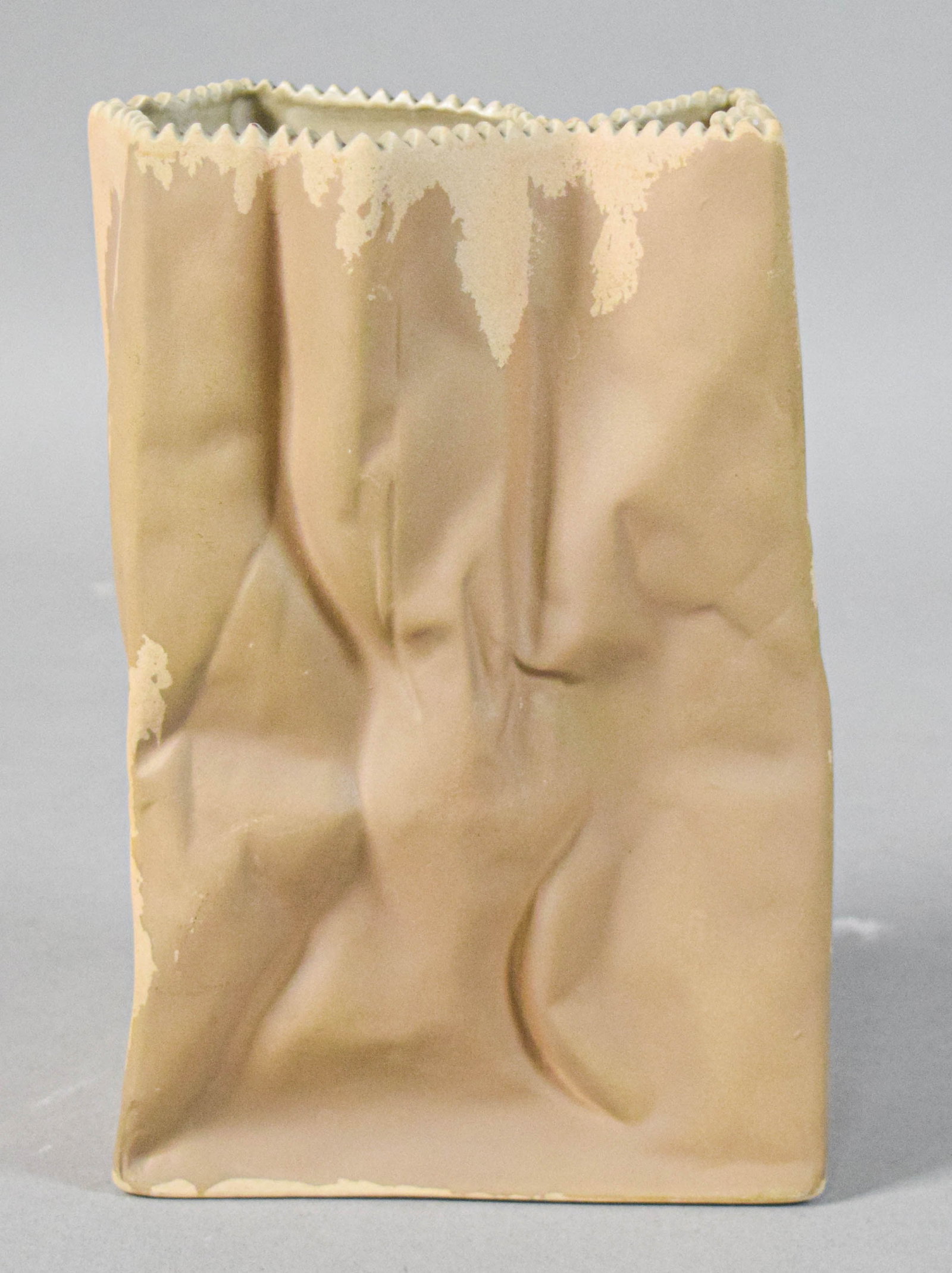 Tapio Wirkkala for Rosenthal Porcelain Paper Bag Vase: Tapio Wirkkala for Rosenthal porcelain paper bag vase. Tan matte finish with mottled patches throughout. Marked Rosenthal on the underside. 7 1/2" H x 6" W x 4" D.