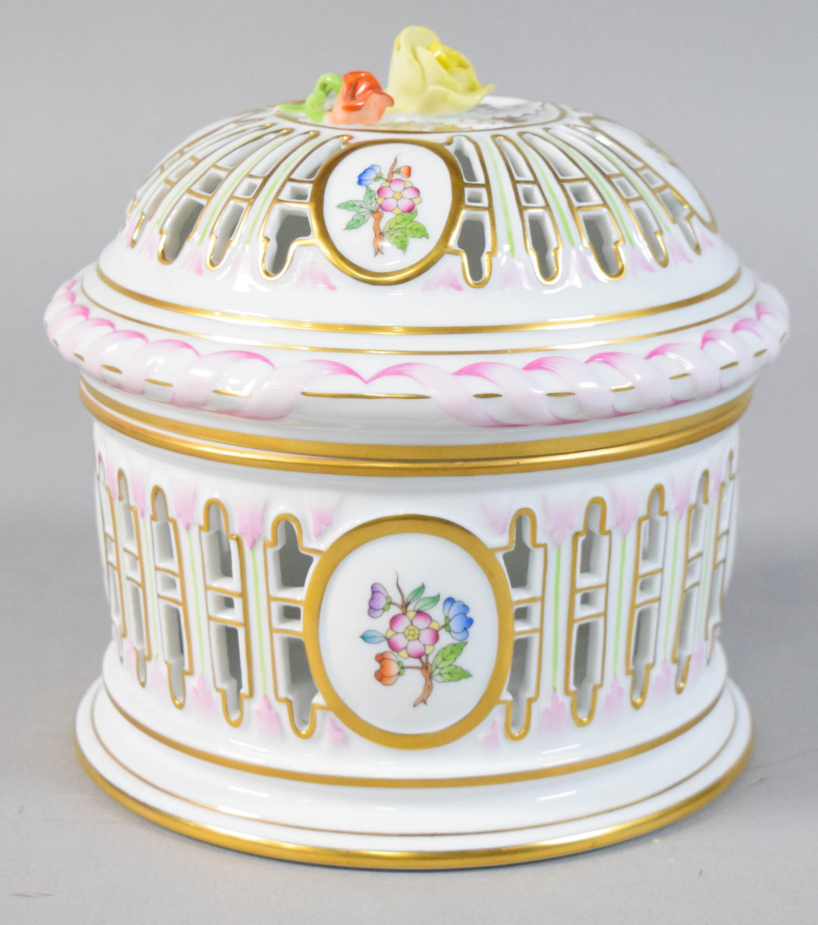 Herend Queen Victoria Porcelain Lidded Jar: Herend porcelain lidded jar in the Queen Victoria pattern. Hand-painted butterflies and floral bouquets. Lid with rose finial. Marked on the underside of the base Herend Hungary. Adhesive label marked