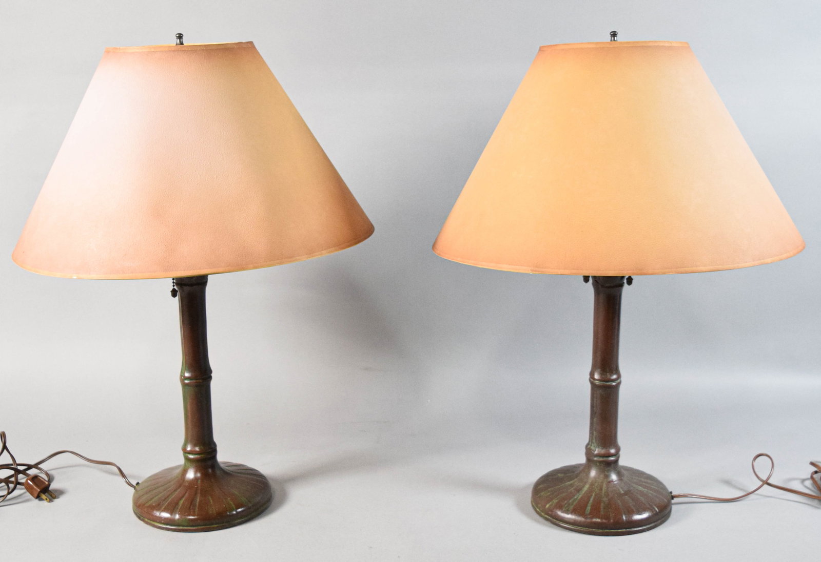 Pair of Signed Handel Bamboo Table Lamp Bases: Pair of Handel bamboo patinated bronze table lamp bases. Early 20th century. Each with three sockets. Tested and working. Both marked Handel on the edge of the base. 24" H x 18" shade diameter. 7 1/2"