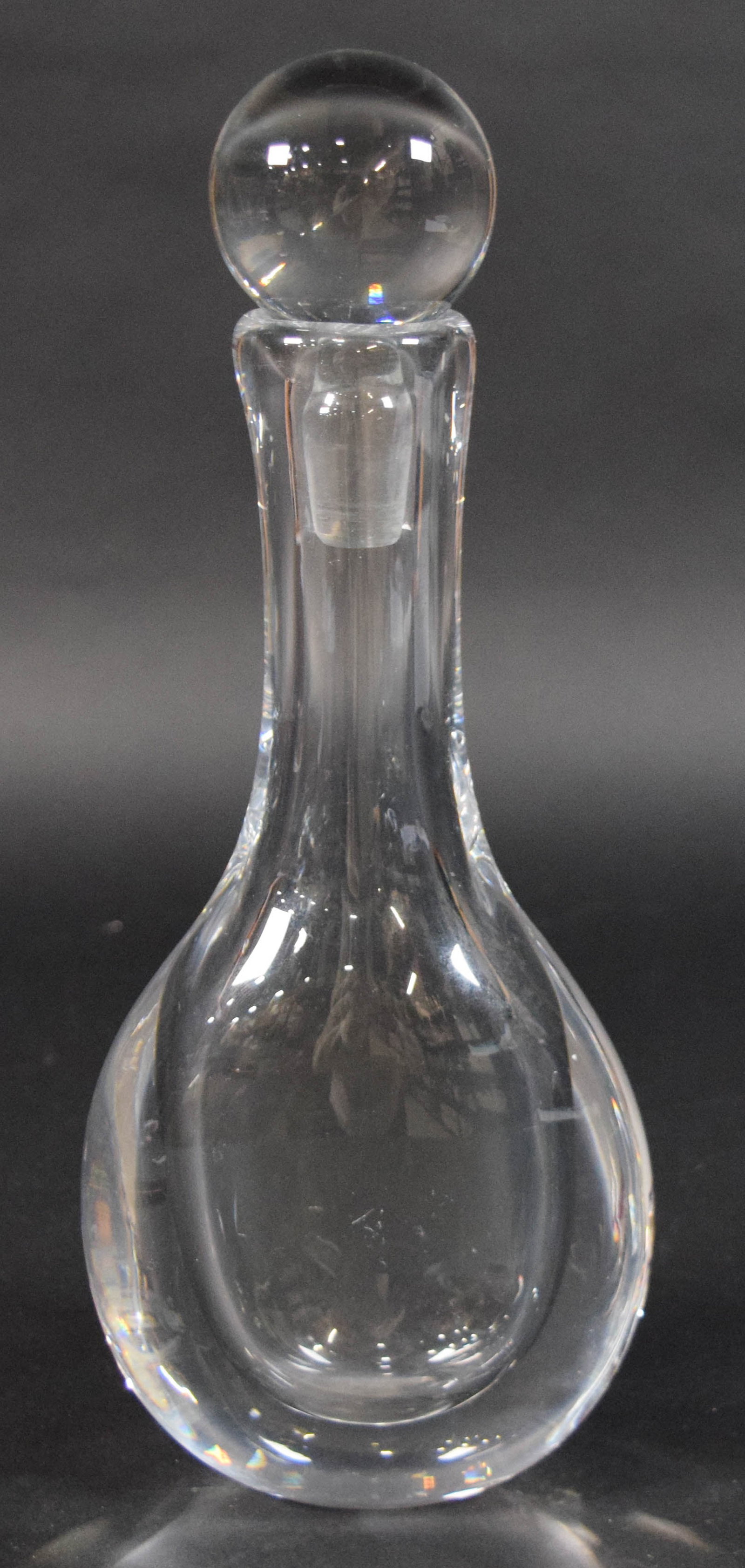 Kosta Crystal Decanter by Goran Warff: Mid-Century Modern Swedish clear crystal decanter by Goran Warff for Kosta. Original solid glass stopper. Incised on the underside Kosta 47904 G. Warff. 12 1/2" H with stopper.