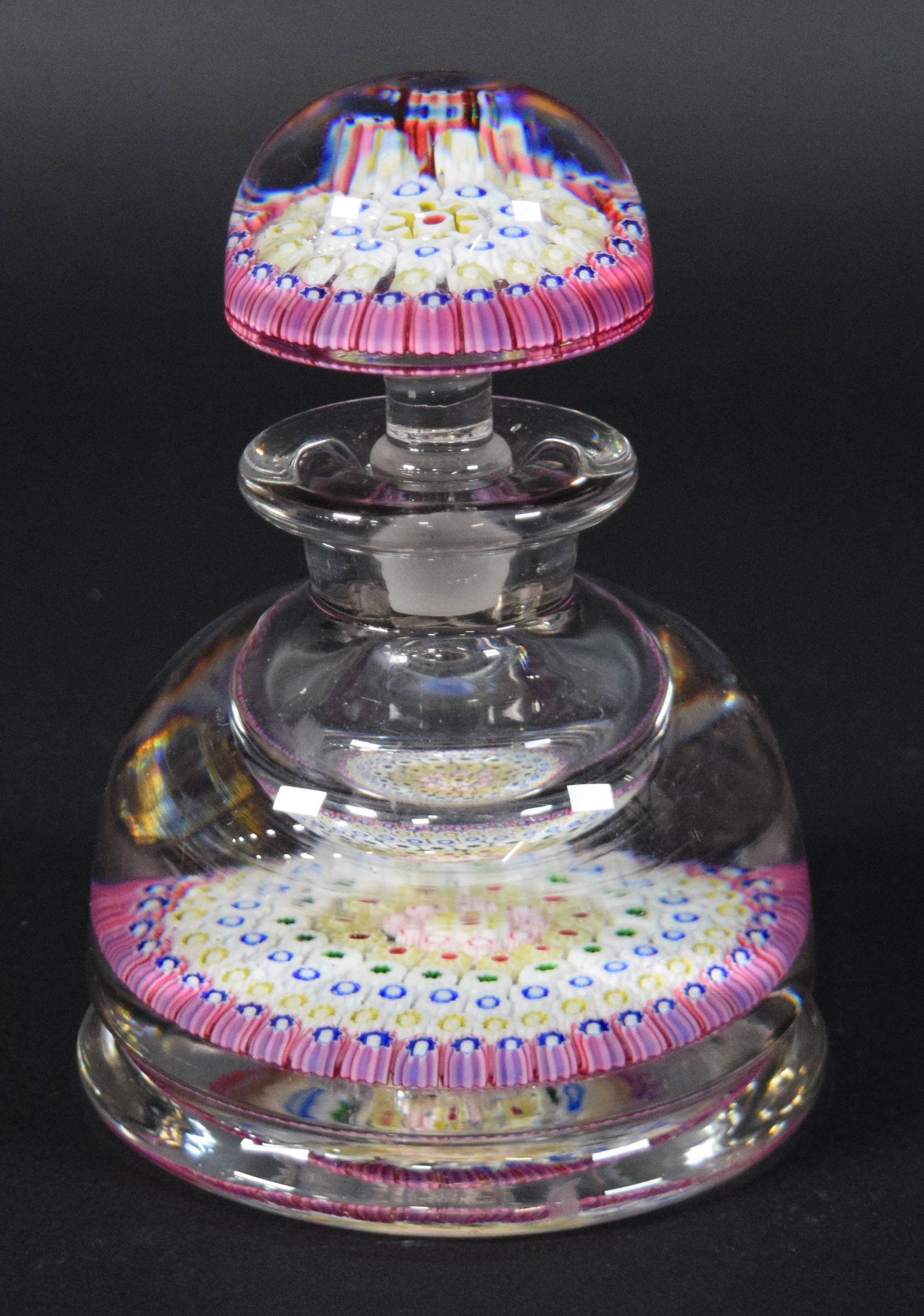 Millefiori Art Glass Paperweight Scent Bottle: Millefiori art glass paperweight scent bottle with matching stopper. Base of the bottle is ground flat and polished. Appears unsigned. 6 1/4" H x 5 1/2" diameter.