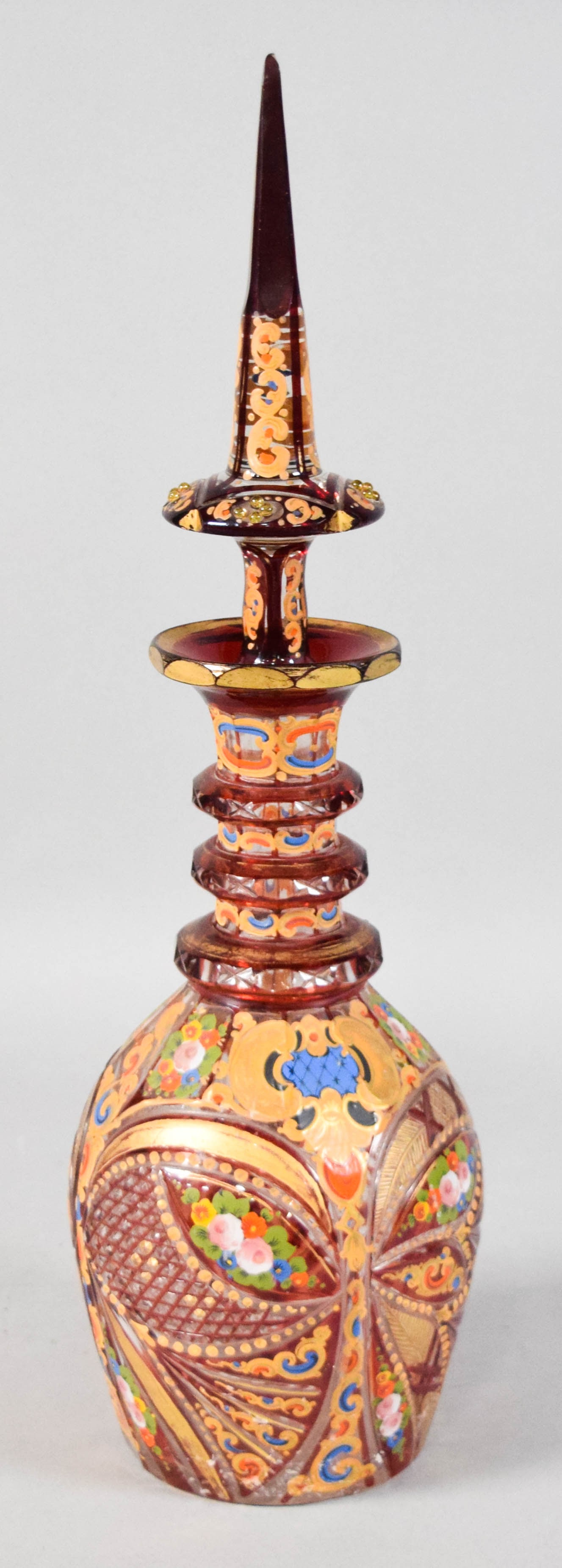 Bohemian Enameled and Gilded Ruby-to-Clear Glass Decanter with Stopper: Bohemian enameled and gilded ruby-to-clear glass decanter with stopper. Late 19th or early 20th century. Diamond and hobnail patterns. Appears unsigned. 20" H with stopper, 11 1/2" H without stopper. 