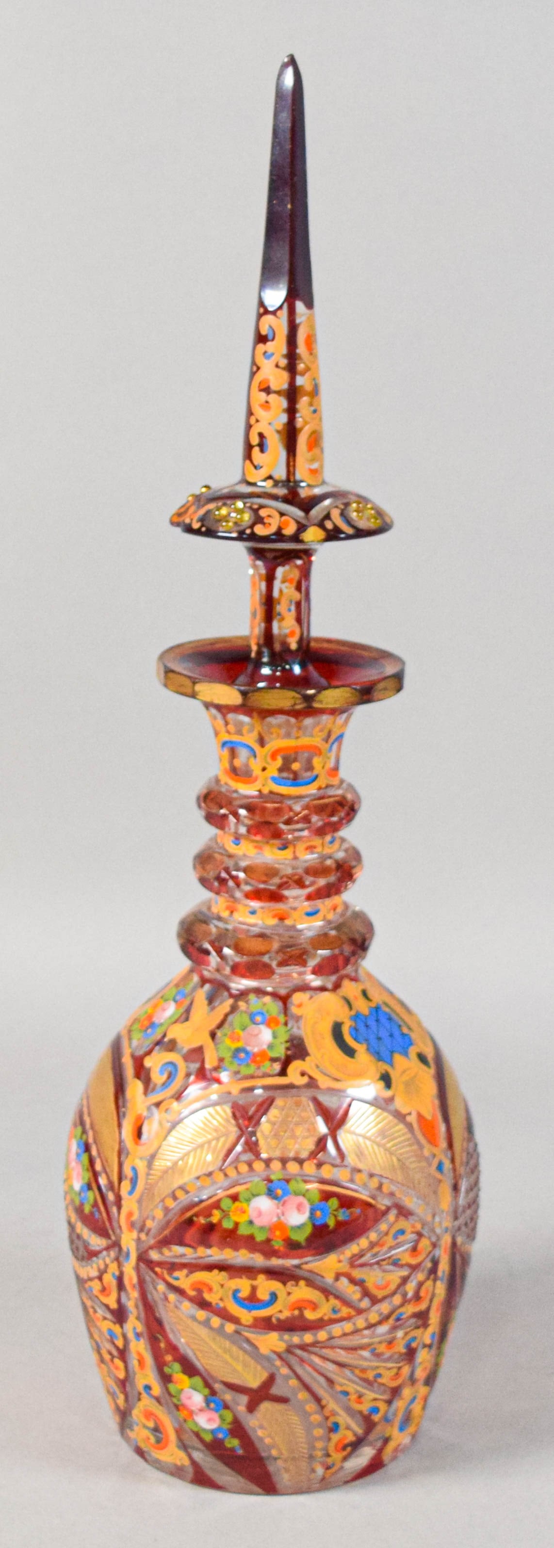 Bohemian Enameled and Gilded Ruby-to-Clear Glass Decanter with Stopper: Bohemian enameled and gilded ruby-to-clear glass decanter with stopper. Late 19th or early 20th century. Diamond and hobnail patterns. Appears unsigned. 20" H with stopper, 11 1/2" H without stopper. 