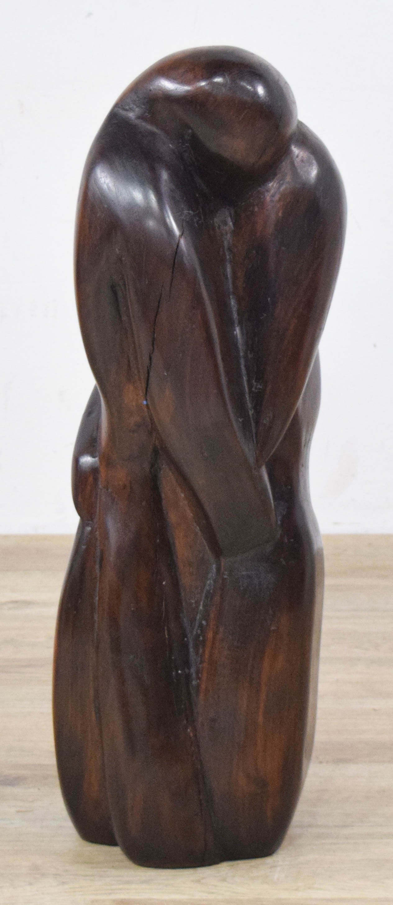 Ben Goodkin Abstract Figurative Wood Sculpture, 1976: Ben Goodkin (American, 20th Century). Abstract wood sculpture carved from dark-stained wood with a smooth, polished finish. Two figures in a fluid embrace, rendered with minimalist lines. Signed and d